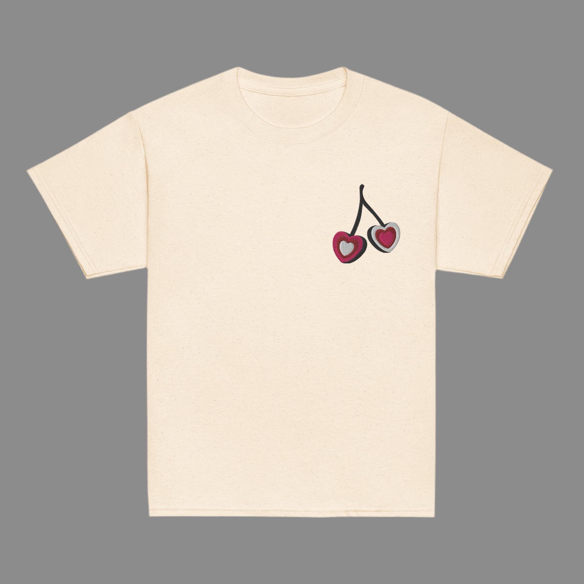 Image: Cherry Embroidery Shirt for Girls. This Valentines Day crewneck tee features two embroidered cherries on the left chest in red, pink and white with black stems. Great gift for tweens and toddlers who love the cherrycore aesthetic, by jaecrece