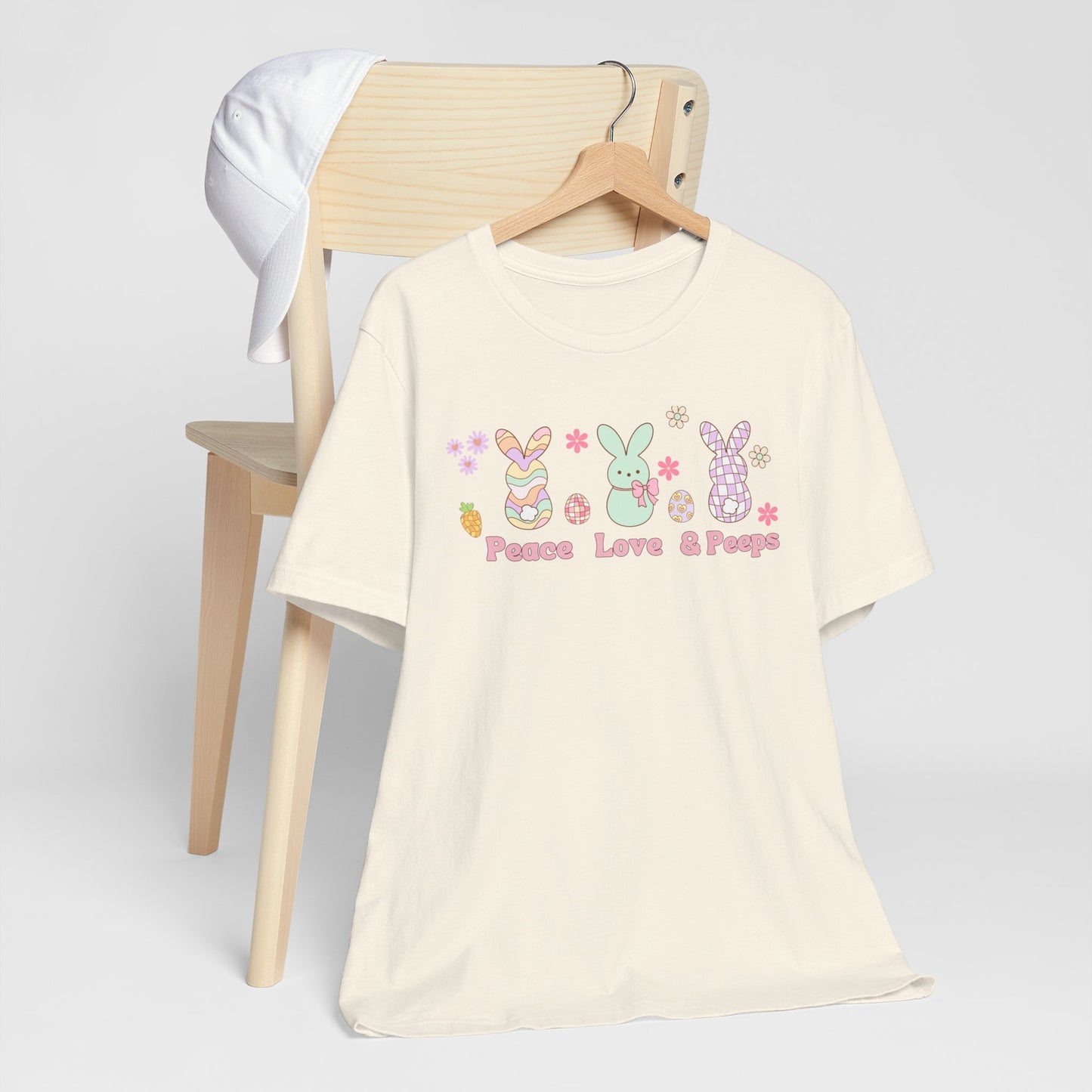 Image: Peace Love and Peeps Easter Shirt for Adults and Children. This Mommy and Me Match Easter Tee features Peeps Easter Candy with Easter Eggs and Daisies. A great Easter shirt for your family holiday celebrations, by jaecrece