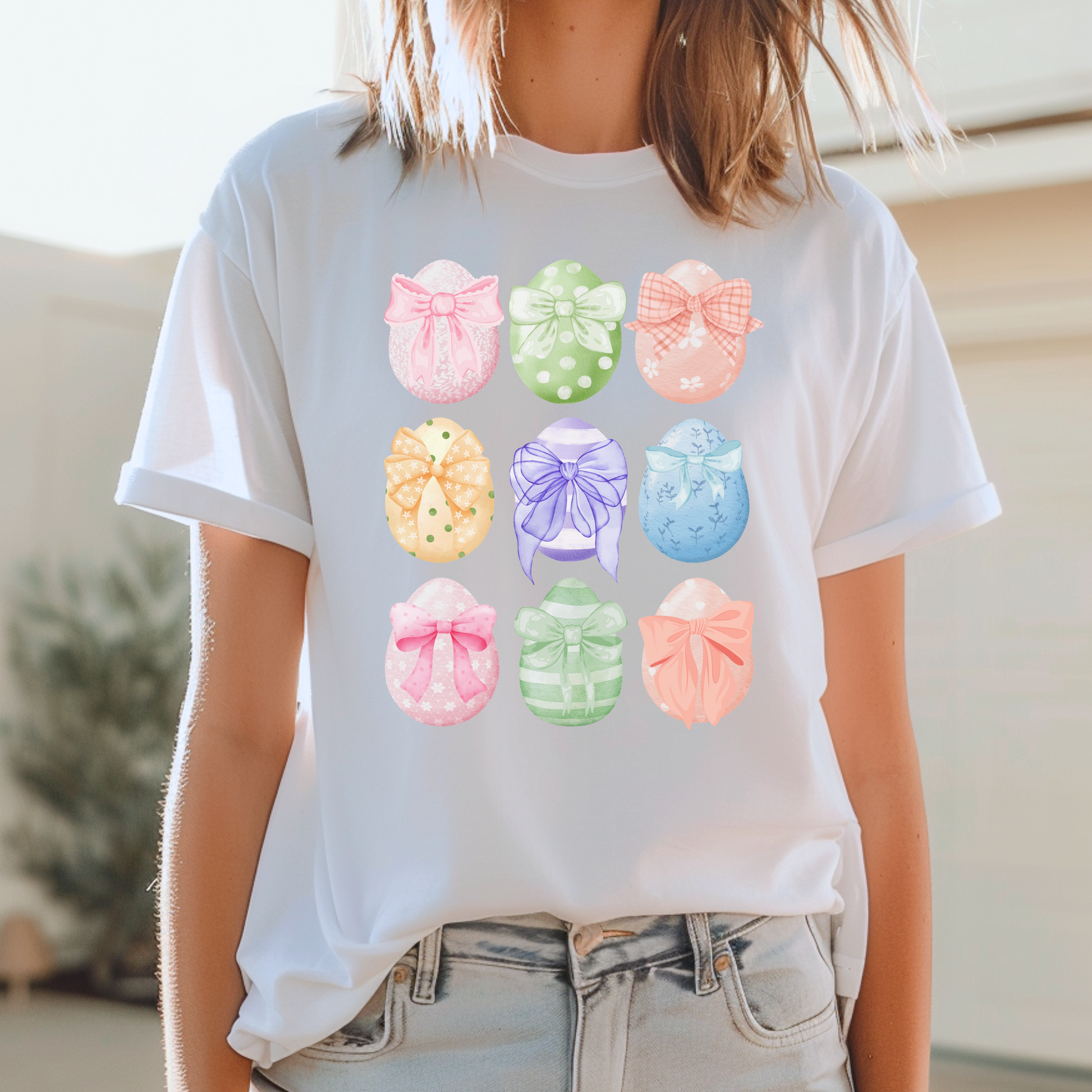 Image: Easter egg tshirt with coquette bows for women. This tee makes a great Easter basket gift, or the perfect outfit for Easter celebrations, by jaecrece