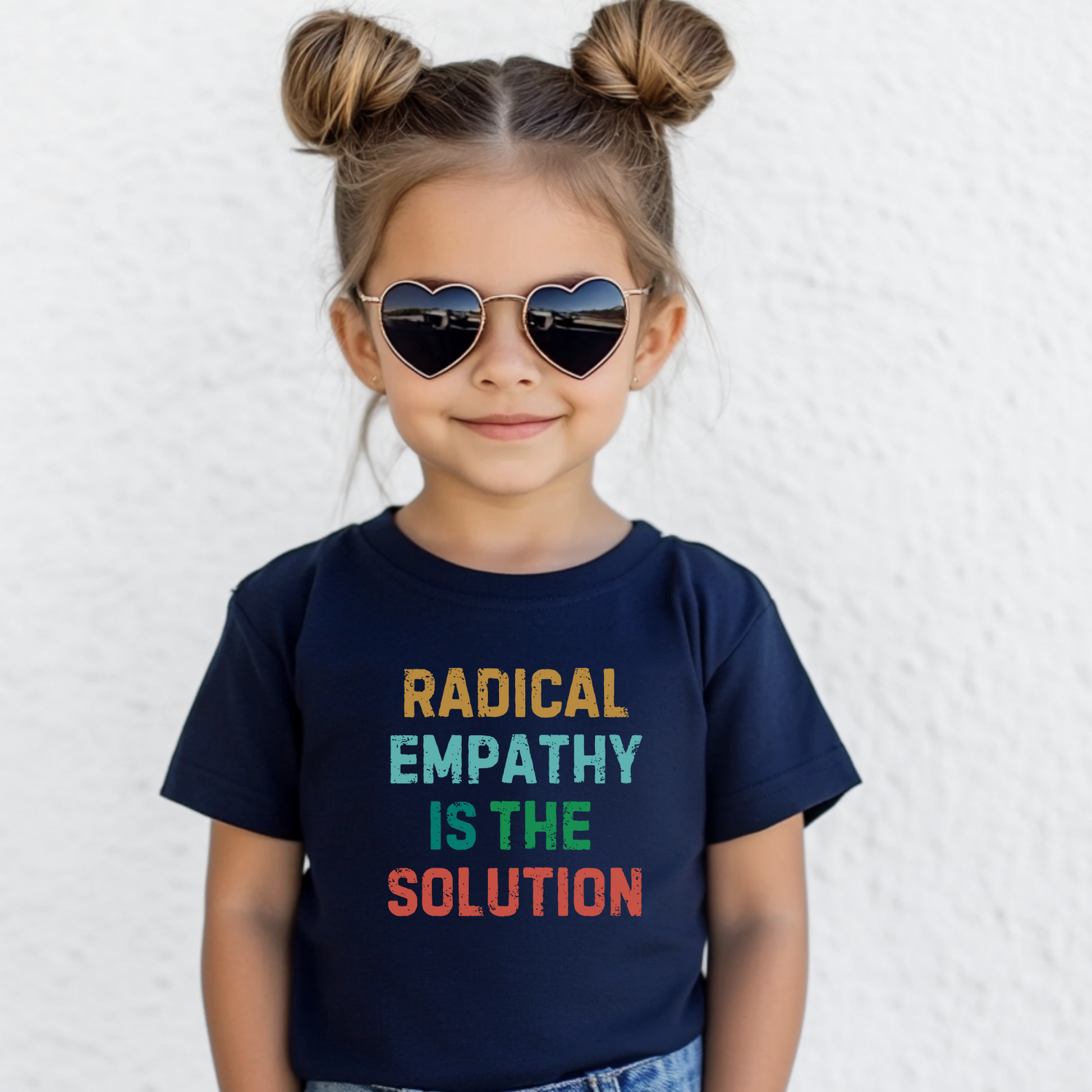 Image: This children's t-shirt features "Radical Empathy is the Solution" in an eye-catching design, encouraging young minds to embrace kindness and understanding. A great conversation starter, this tee is perfect for kids who stand against hate and promote equality. Soft and comfortable, it's ideal for daily wear or activism events, by jaecrece.