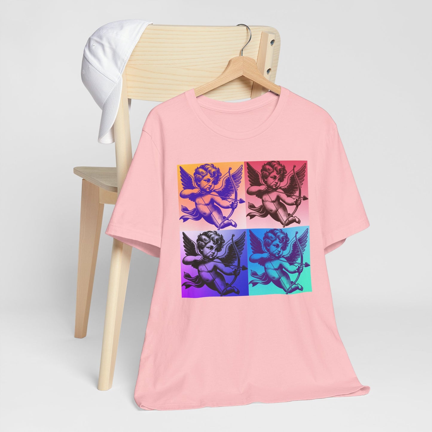 Cute and comfy adult Valentine shirt with Cupid graphic, inspired by retro pop art style. Featuring a dreamy pastel cloud scene, this shirt fits XS–5XL and comes in black, white, or pink. Ideal for artsy types, couples, and families who want to match across generations. This design is also perfect for coquette aesthetic lovers looking for a bold statement tee with softness and comfort.