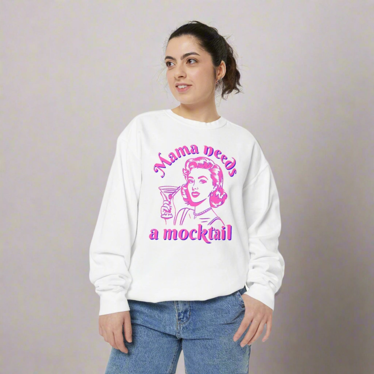 Image: Mama Needs a Mocktails Sweatshirt. This womens pullover features a 1950s pop art graphic of a woman holding a cocktail glass, with the text Mama needs a mocktail. A perfect gift for a friends soberversary, or for a newly pregnant friend who needs mocktails during their pregnancy, by jaecrece