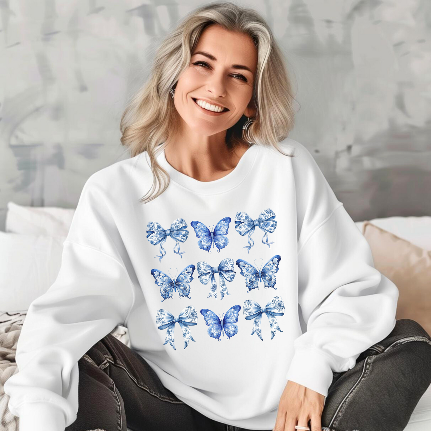 Image: Blue Toile Butterflies & Bows Sweatshirt for women, available in XS–XL, crafted for fans of soft cottagecore, Southern preppy, or vintage charm. Featuring fluttering butterflies and delicate ribbon motifs, this sweatshirt adds a cozy, elegant feel to any wardrobe. Coordinate with matching toddler and girls pieces for a full family look or wear solo with your favorite denim, by jaecrece.