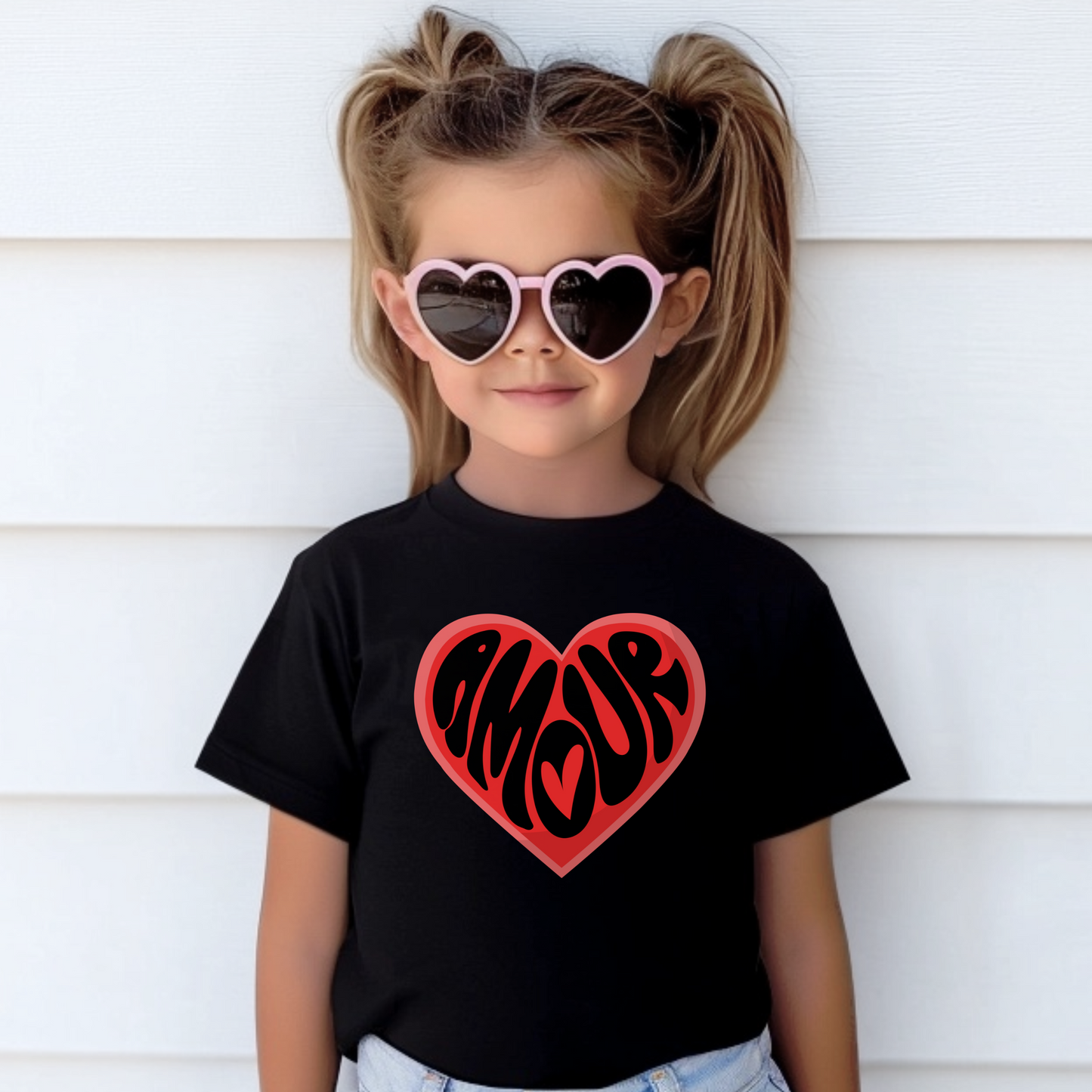 Soft, stylish, and full of heart—this Amour Love Girls T-shirt brings French flair to your daughter’s Valentine outfit. Featuring a bold heart design with “Amour,” this tween-friendly tee in sizes XS–XL fits the coquette and soft girl aesthetic. A must-have gift for girls who love Paris or French culture, this Valentine’s Day shirt pairs well with skirts, jeans, or leggings. Great for mommy and me sets or Galentine’s celebrations.