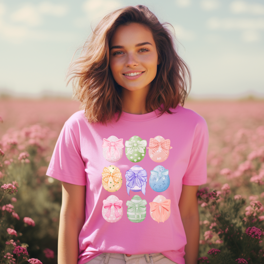 Image: Easter egg tshirt with coquette bows for women. This tee makes a great Easter basket gift, or the perfect outfit for Easter celebrations, by jaecrece