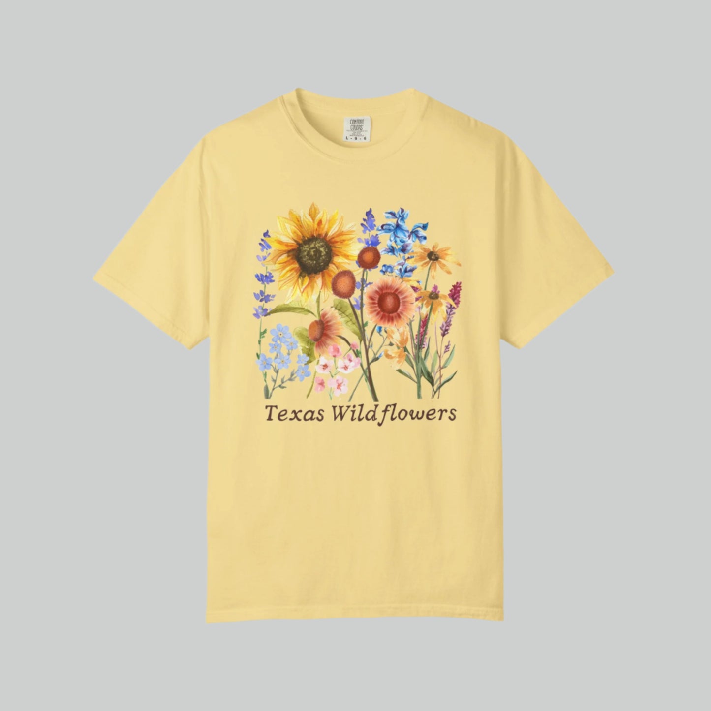 Vintage floral Texas t-shirt with bluebonnets and spring wildflowers, printed on soft Comfort Colors cotton. Designed for flower field lovers and soft girl fashion, this shirt is ideal for Texas adventures or cozy weekends. With a breathable, relaxed fit, it’s a charming wardrobe piece for any country girl or wildflower fan.