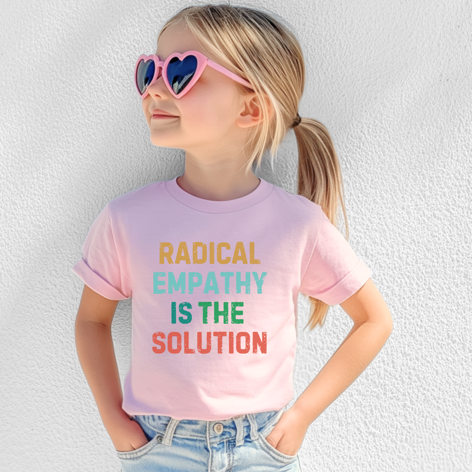 Image: This children's t-shirt features "Radical Empathy is the Solution" in an eye-catching design, encouraging young minds to embrace kindness and understanding. A great conversation starter, this tee is perfect for kids who stand against hate and promote equality. Soft and comfortable, it's ideal for daily wear or activism events, by jaecrece.