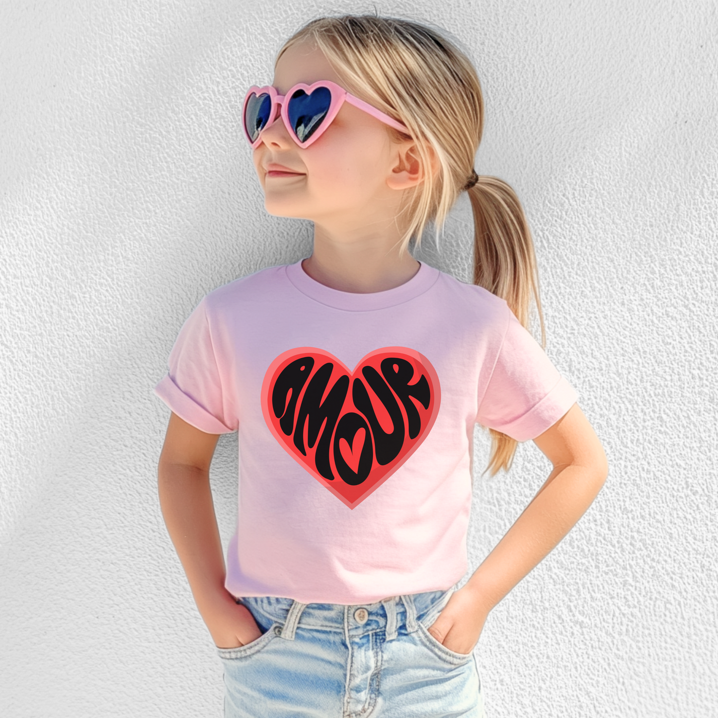 Amour Love Girls T-shirt blends Parisian charm with a coquette soft girl aesthetic, available in youth sizes XS–XL. This cute French word shirt makes the perfect Valentine’s Day gift for daughters, tweens, or mini Francophiles. Ideal for mommy and me matching outfits or Galentine’s Day parties, the heart graphic adds a trendy statement to any outfit. A perfect choice for family photos, school events, or casual French-themed looks.