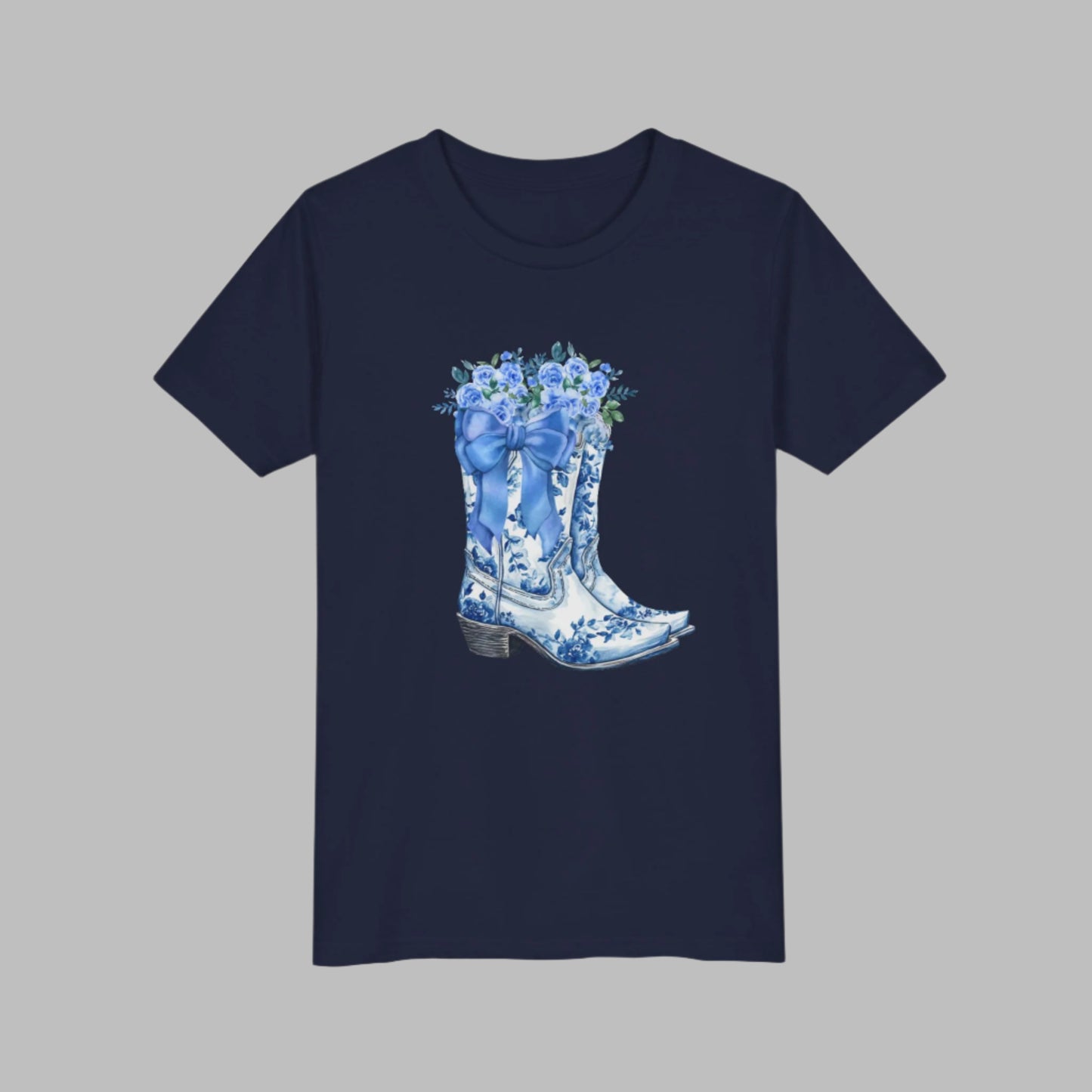 Image: Designed for girls in sizes S to XL, this country-chic sweatshirt features a whimsical scene of cowgirl boots, a blue ribbon, and floral accents. A coastal cowgirl favorite, this pullover adds just the right touch of southern sweetness to any outfit. Ideal for daughters who love soft blues, western vibes, and cozy statement pieces they can wear anywhere, by jaecrece.