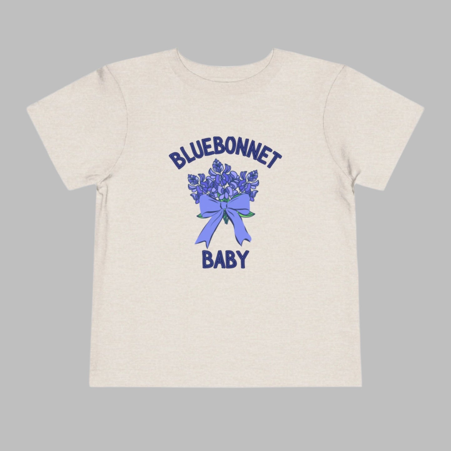 Image: This cute toddler t-shirt features a stunning bluebonnet design, making it a great outfit for spring adventures. The breathable cotton fabric ensures comfort for all-day wear at family gatherings, nature walks, or Easter celebrations. Designed with Texas pride in mind, it’s a must-have for parents who love their state’s wildflowers. A perfect baby shower gift or birthday present for Texas-born little ones, this tee is a springtime favorite, by jaecrece.