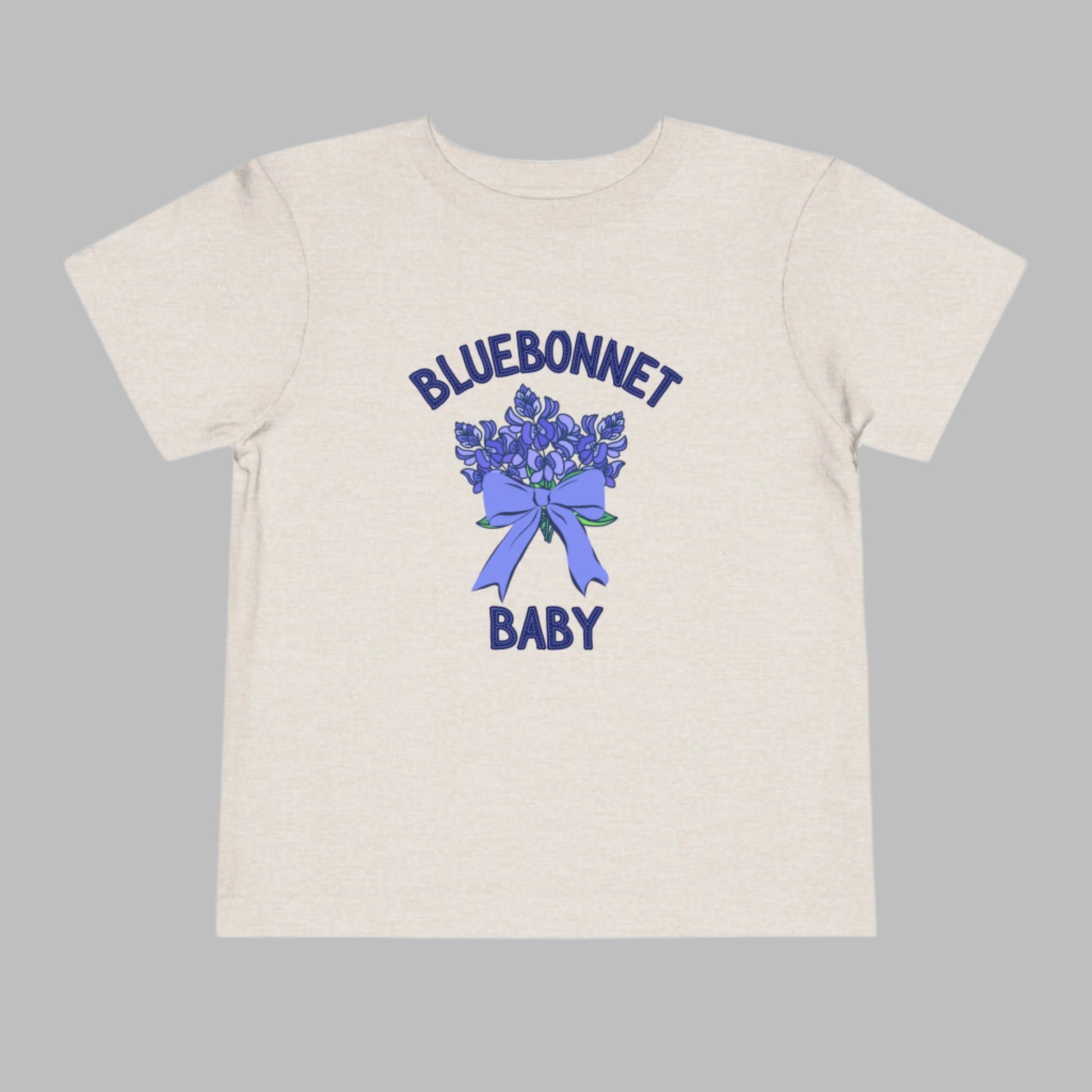 Image: This cute toddler t-shirt features a stunning bluebonnet design, making it a great outfit for spring adventures. The breathable cotton fabric ensures comfort for all-day wear at family gatherings, nature walks, or Easter celebrations. Designed with Texas pride in mind, it’s a must-have for parents who love their state’s wildflowers. A perfect baby shower gift or birthday present for Texas-born little ones, this tee is a springtime favorite, by jaecrece.
