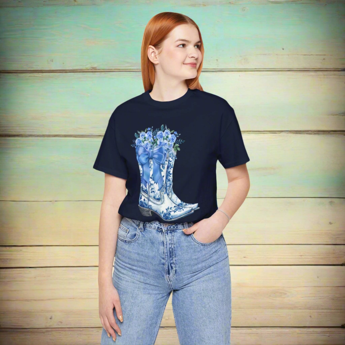 Image: Blue Toile Boots and Bows shirt in sizes for women. This pullover shirt features a pair of coastal cowgirl aesthetic cowboy boots with a blue bow and blue wildflowers. This country themed sweater makes a perfect gift for your daughter, or for the boujee mama in your life, by jaecrece
