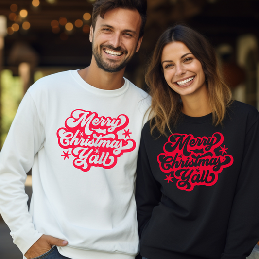 This Merry Christmas Y’all adult sweatshirt features bold red script across the chest, printed on a soft Gildan 18000 crewneck. A cozy and festive option for the holiday season, this unisex pullover is perfect for matching family Christmas outfits. Whether you're taking family photos or hosting a holiday gathering, this warm southern-style sweatshirt adds charm and comfort to your Christmas wardrobe.