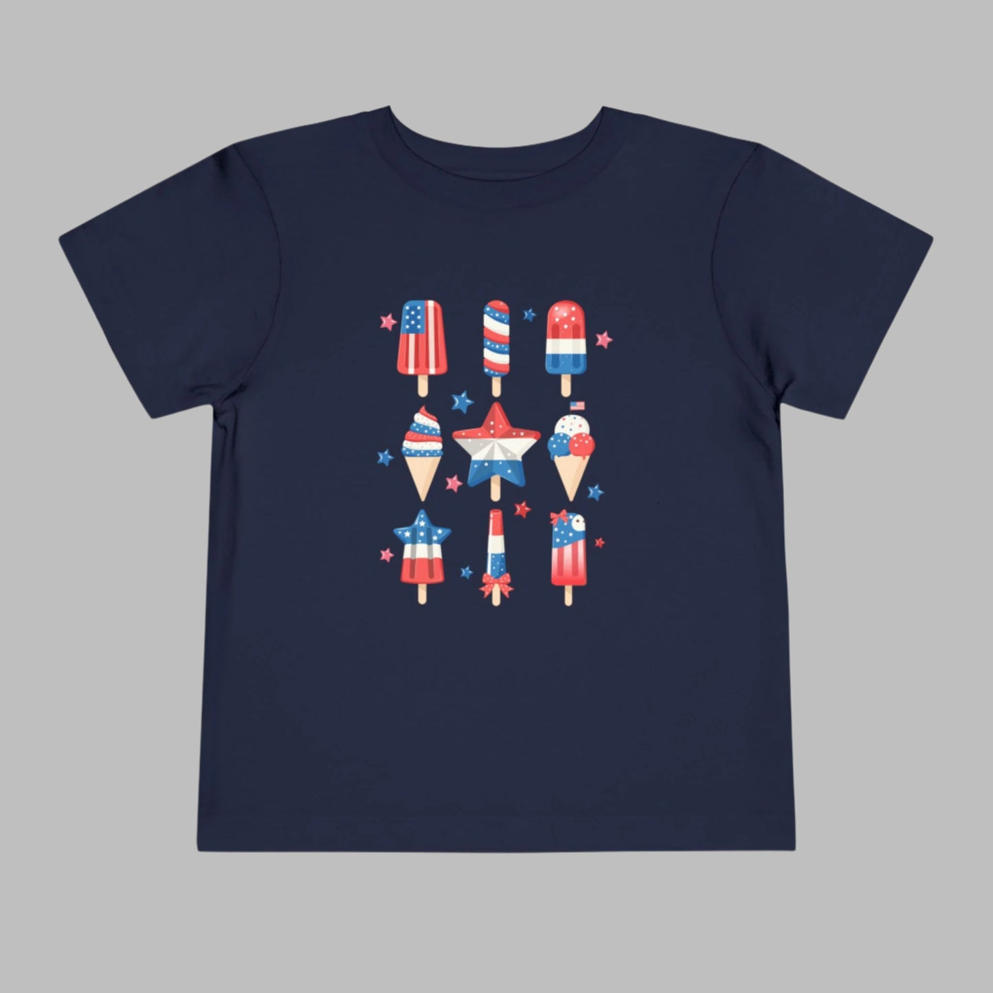 Image: Toddler Fourth of July tee with a fun popsicle print in bold patriotic colors. This red white and blue shirt is designed for summer holidays, making it a must have for Independence Day, Memorial Day, or a casual picnic at the park. Dress your toddler in this cute tee for matching family looks or solo style that’s full of American charm, by jaecrece.