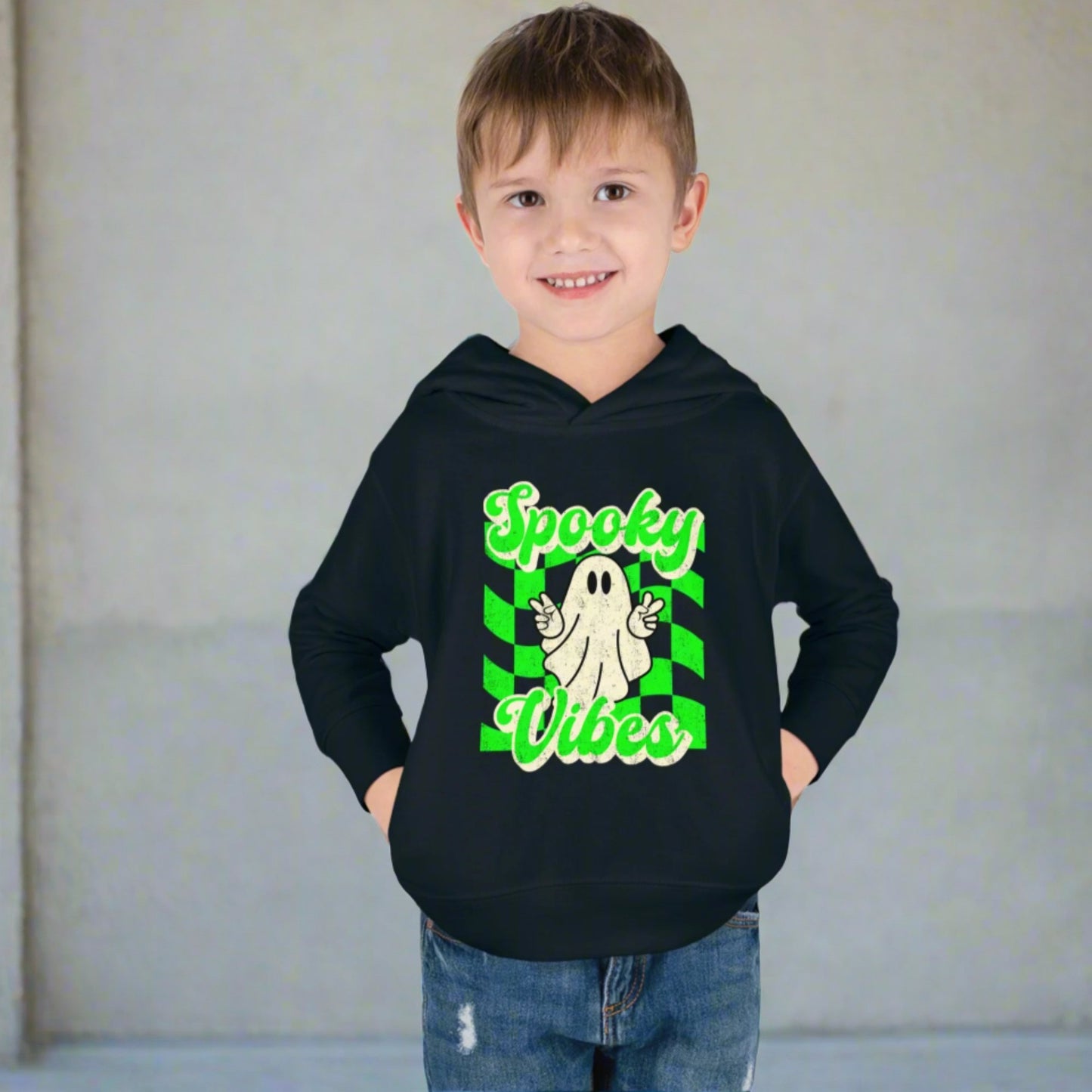 Spooky Vibes Halloween Toddler Hoodie. Featuring a green checkerboard design with a cute ghost giving peace signs, with the text spooky vibes. Mommy and Me/ Family Matching options, by jaecrece
