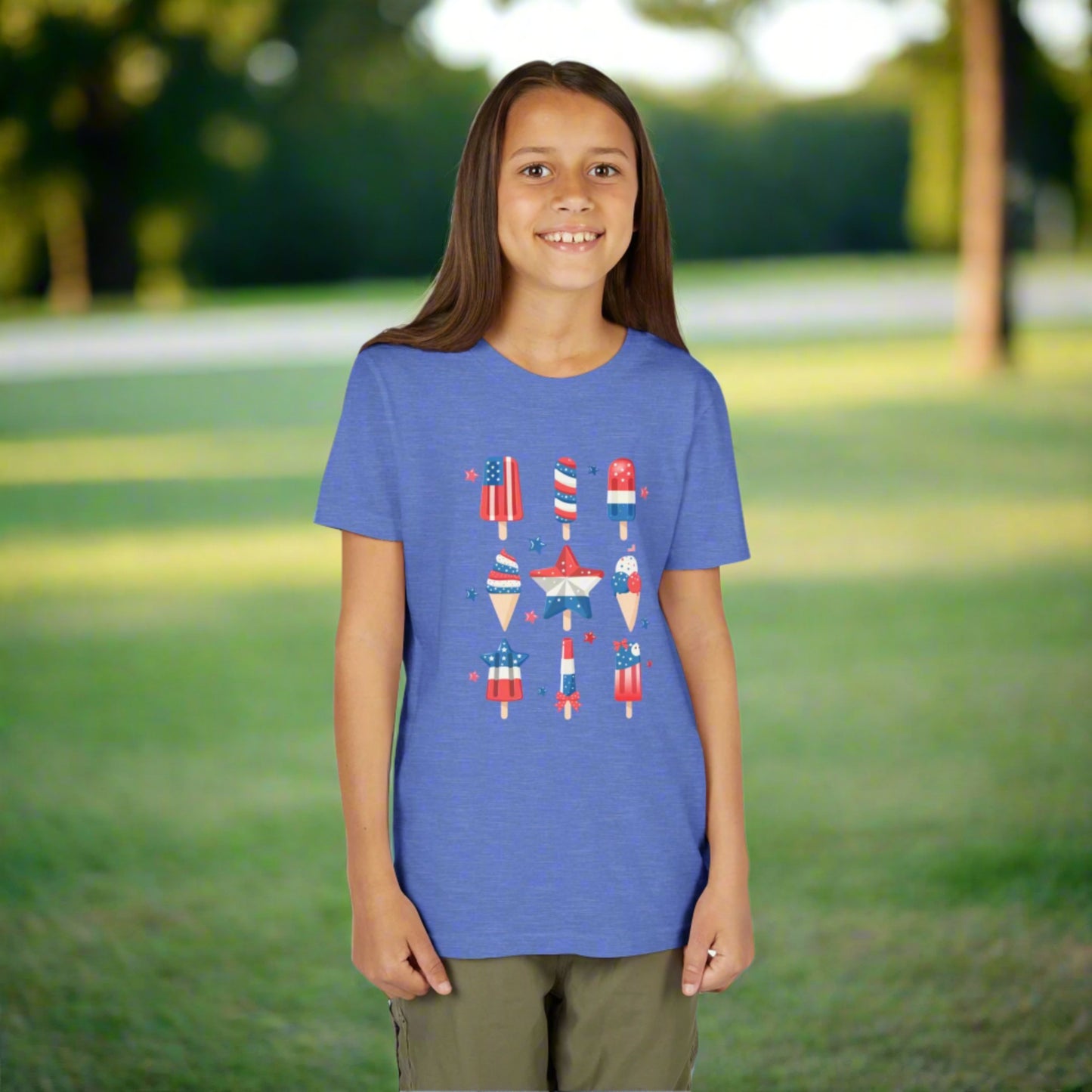 Image: Kids will love this red white and blue popsicle shirt that captures the spirit of summer and American pride. Designed in child sizes S to XL, it features a patriotic frozen treat that is both trendy and playful. Perfect for Fourth of July parades, Memorial Day cookouts, or any warm weather holiday, this tee makes a bold statement for little patriots, by jaecrece.