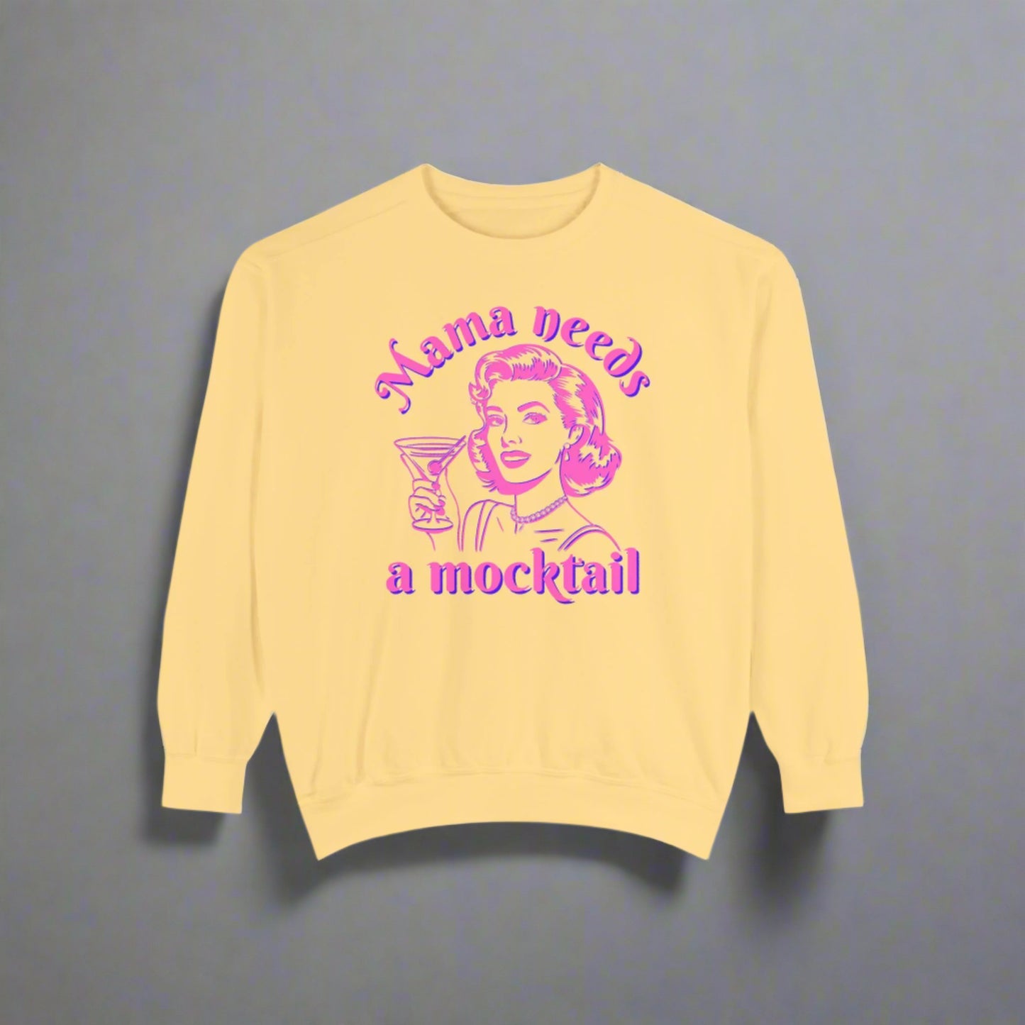 Image: Mama Needs a Mocktail Sweatshirt. Comfort Colors Butter Hot pink neon graphic with a pop art mom holding a cocktail glass, with the text Mama Needs a Mocktail. Its a funny way to celebrate recovery in your life, or in the life of a friend, by jaecrece