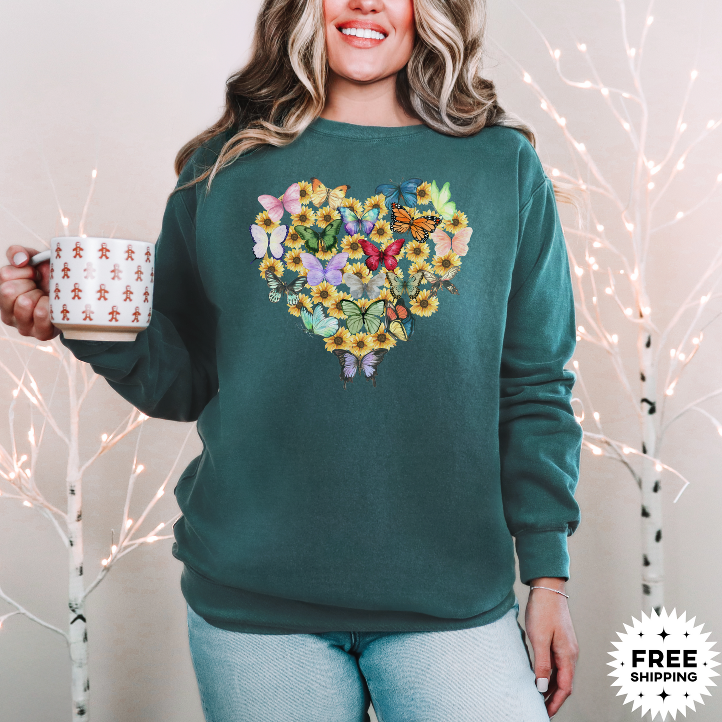 Image: Butterfly Sunflower Heart Womens Sweatshirt. This nature inspired cozy pullover sweatshirt has  watercolor wildflowers and butterflies. Comfort colors available in violet, Blue spruce and denim. Great for Earth Day, Valentines Day, by jaecrece