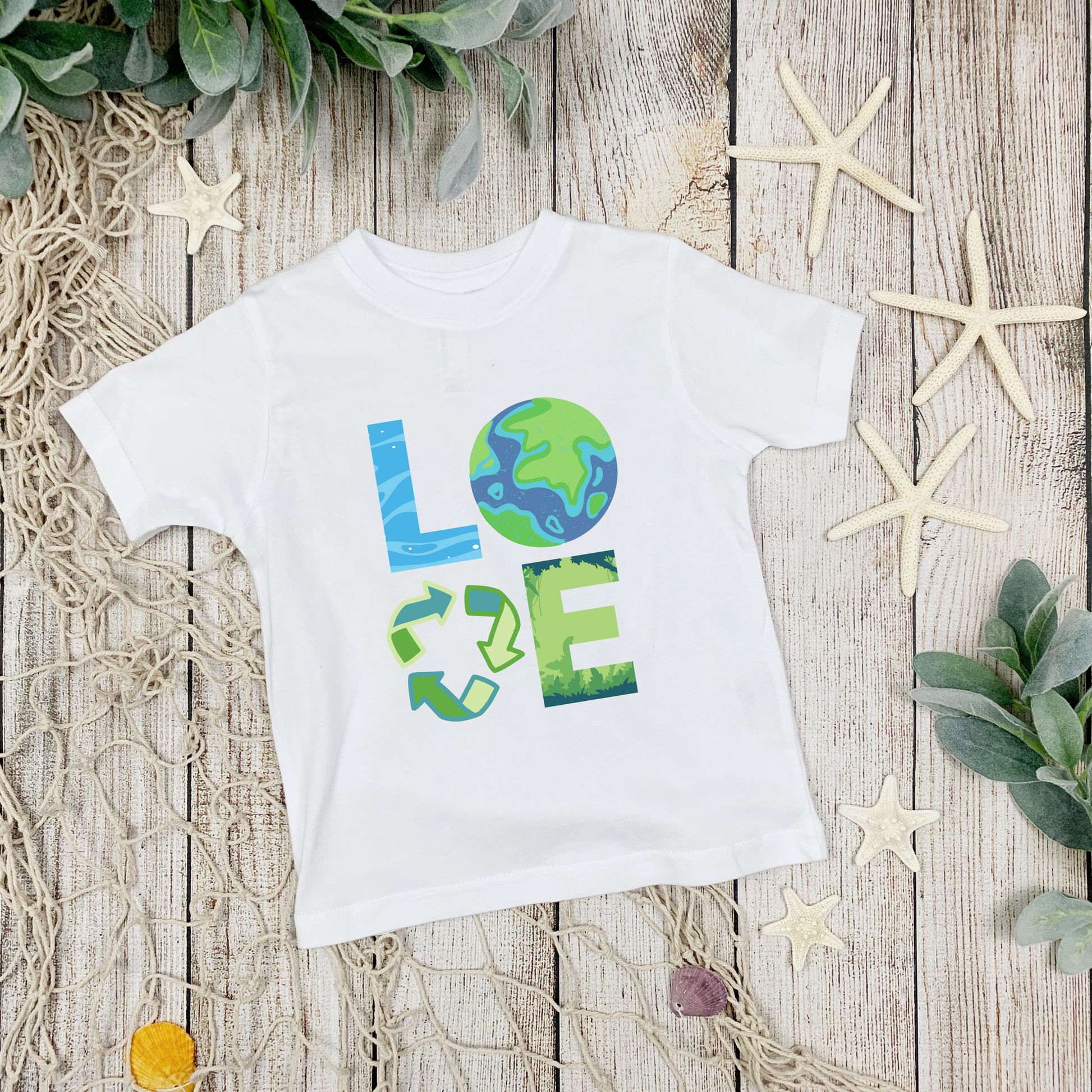 Image: A Love Earth Day shirt designed for babies and toddlers, featuring bold letters that each symbolize an element of nature. The L resembles flowing water, the O is designed as the Earth, the V represents the reduce reuse recycle symbol, and the E is shaped like plants and trees. This eco friendly tee is perfect for Earth Day celebrations, environmental events, and spreading awareness about sustainability and conservation, by jaecrece.
