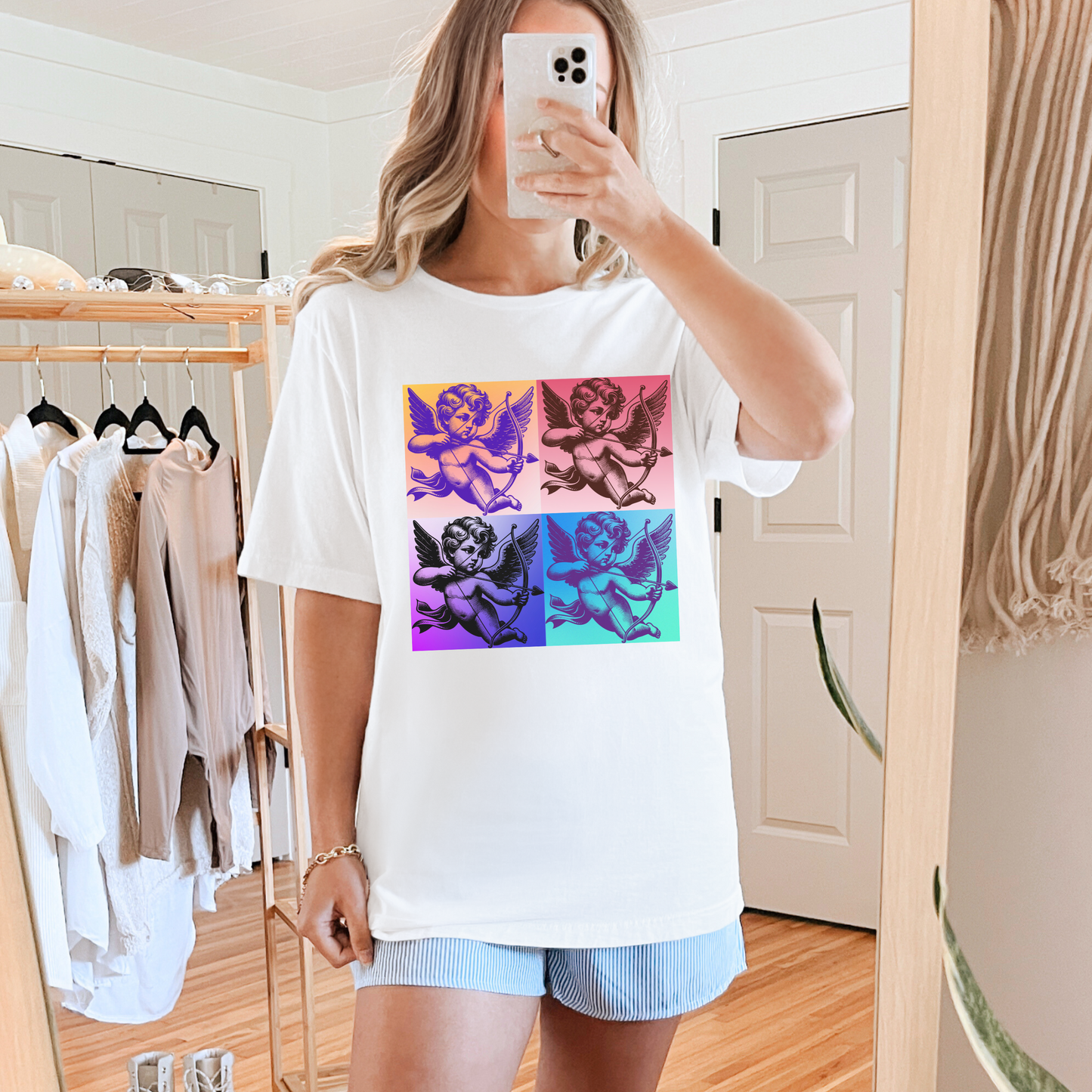 Expressive adult graphic tee for Valentine’s Day featuring a Cupid in a dreamy cloudscape. This shirt blends the soft girl aesthetic with bold pop art design, available in black, white, and pink. Offered in XS through 5XL, this comfy Bella Canvas tee is ideal for matching with your little ones or partner thanks to toddler and youth sizes in the same design. A fun, family-friendly Valentine fashion option.