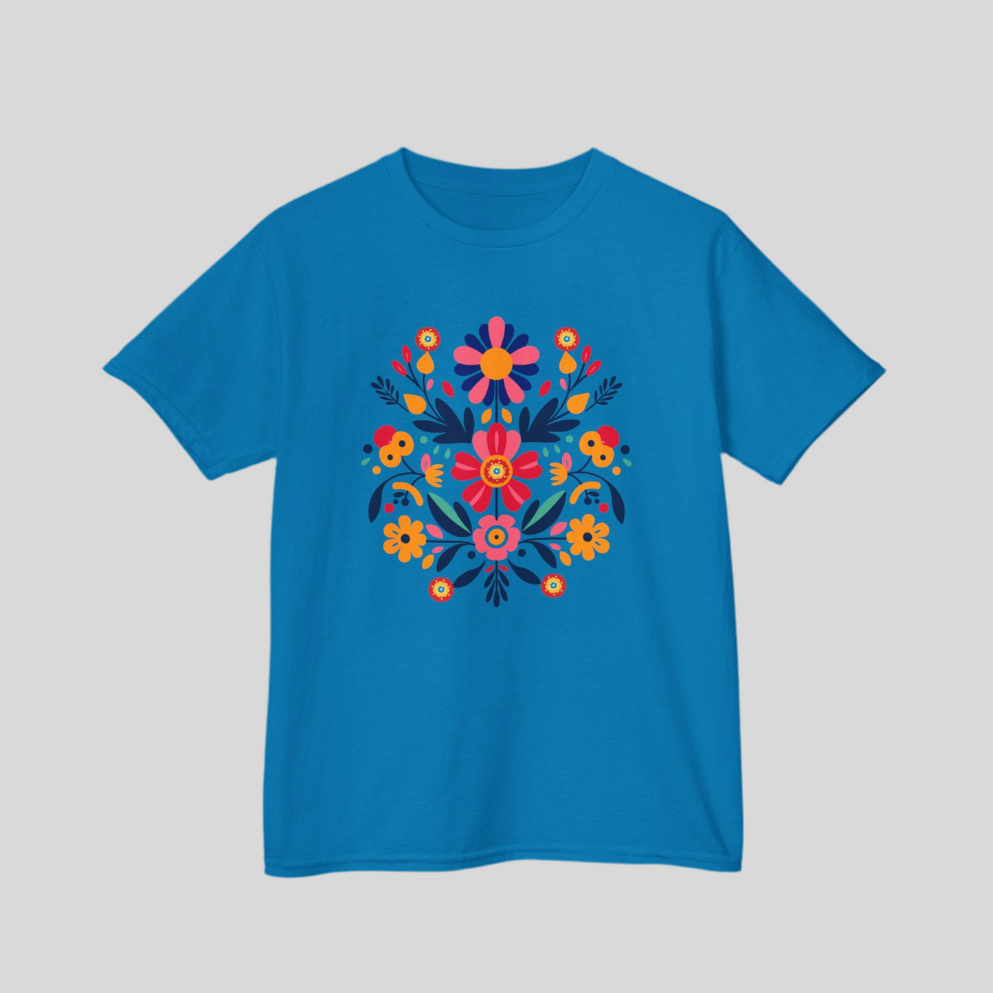 Girls’ Otomi T-shirt in soft midweight cotton featuring a bold floral and leaf print inspired by Mexican folk art. Available in youth sizes XS–XL, this classic crew neck top is perfect for school, summer outings, or family celebrations. With its bright artisan print and comfy fit, this kids’ tee is a go-to for Latinx cultural fashion, heritage clothing, or girls’ boho wardrobe staples.