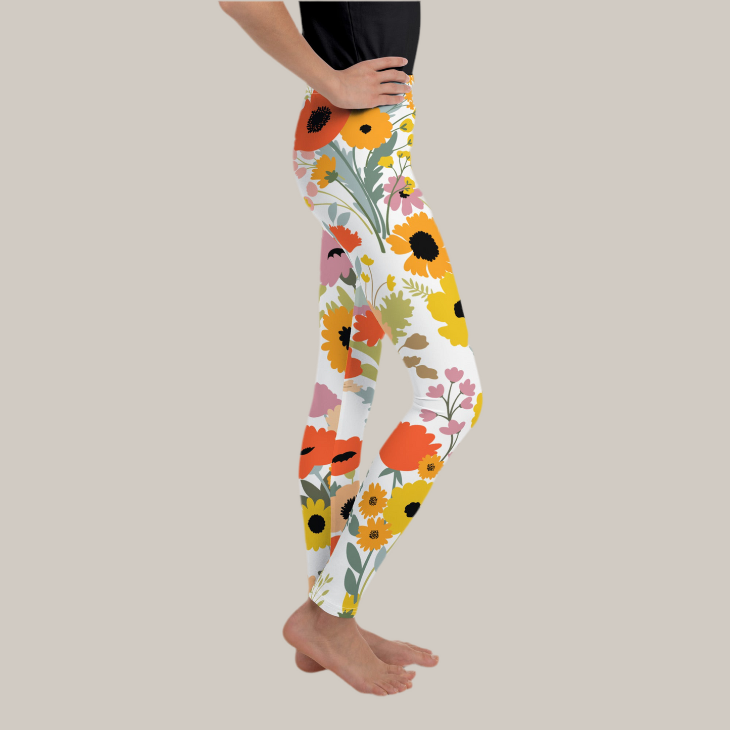 Image: Capture the spirit of spring with our watercolor wildflower youth leggings, available in sizes 8–20 for girls and teens. These floral leggings bring soft comfort and blooming charm with their colorful flower print on a white background. Great for festivals, Easter celebrations, or a spring family picnic. Pair them with matching toddler or mom leggings for an adorable coordinated look that pops in photos, by jaecrece.