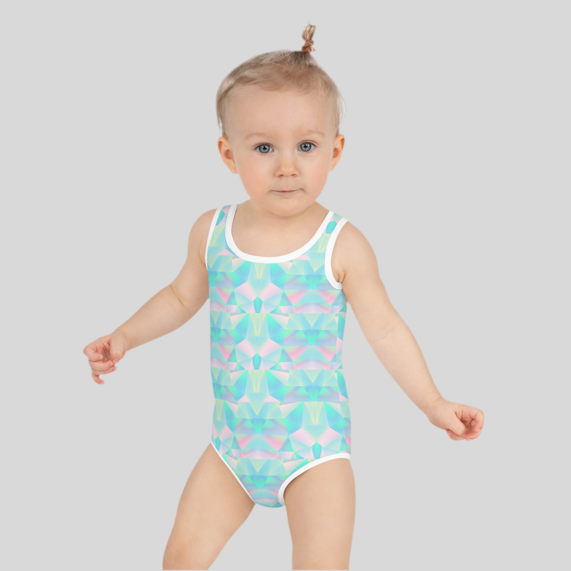 Pastel rainbow swimsuit for toddler girls, sizes 2T–7, crafted with smooth microfiber yarn and durable stitching for comfort and movement. UPF 38–40 fabric keeps your child safe under the sun, while the double-layered design adds coverage. This playful summer swimsuit is part of a family matching collection that includes options for girls, women, men, and a pastel beach towel, perfect for poolside family memories.