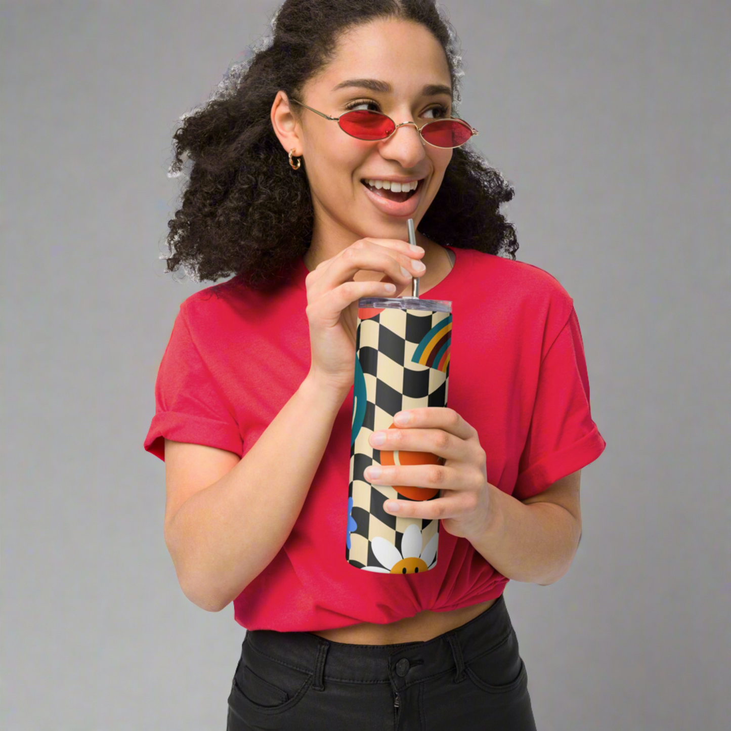 Smiley Face Checkerboard 20 oz Stainless Steel Tumbler, created with a fun black and tan checker pattern with rainbows, smiley faces and daisies, by jaecrece.com