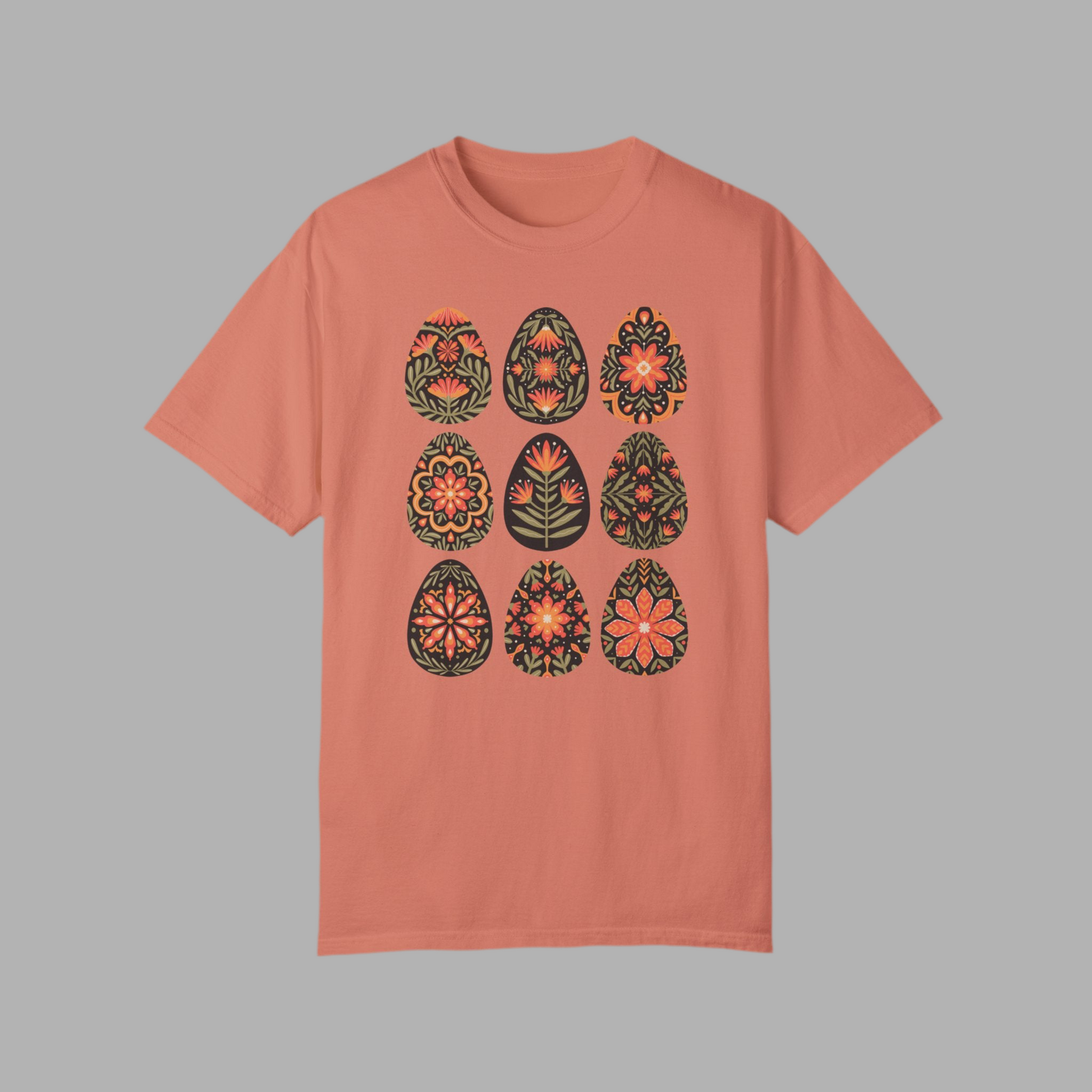 Image: This folk art Easter shirt features a vibrant floral and botanical Easter egg design with vintage Scandinavian influences. The intricate patterns reflect traditional Nordic craftsmanship, creating a timeless spring fashion statement. Perfect for casual outings or Easter festivities, this soft and stylish t-shirt brings together the beauty of cottagecore, boho aesthetics, and Swedish hygge in one charming piece, by jaecrece.