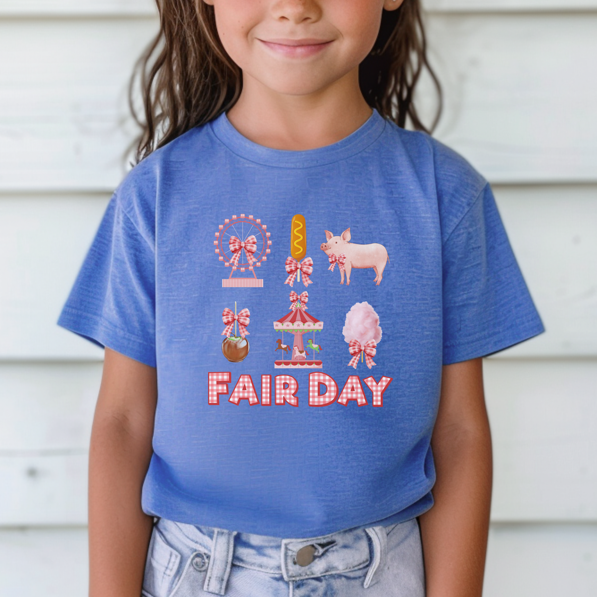 Image: Whimsical Fair Day shirt adorned with gingham lettering and vintage fair icons like a Ferris wheel, caramel apple, pig, and cotton candy. A must have for any fair lover, this top is perfect for a soft girl aesthetic and makes a great addition to state fair outfits. Ideal for county fairs, 4H events, and stock shows, it is available in toddler, girl, and women’s sizes to create adorable mommy and me matching looks, by jaecrece.