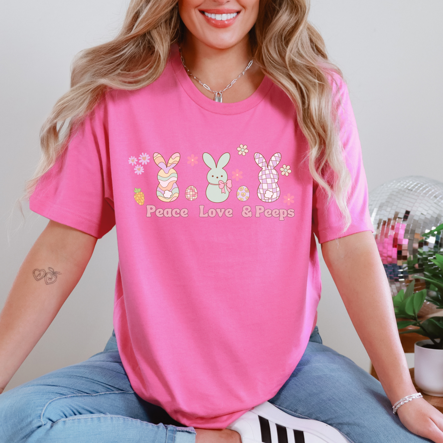 Image: Peace Love and Peeps Easter Shirt for Adults and Children. This Mommy and Me Match Easter Tee features Peeps Easter Candy with Easter Eggs and Daisies. A great Easter shirt for your family holiday celebrations, by jaecrece