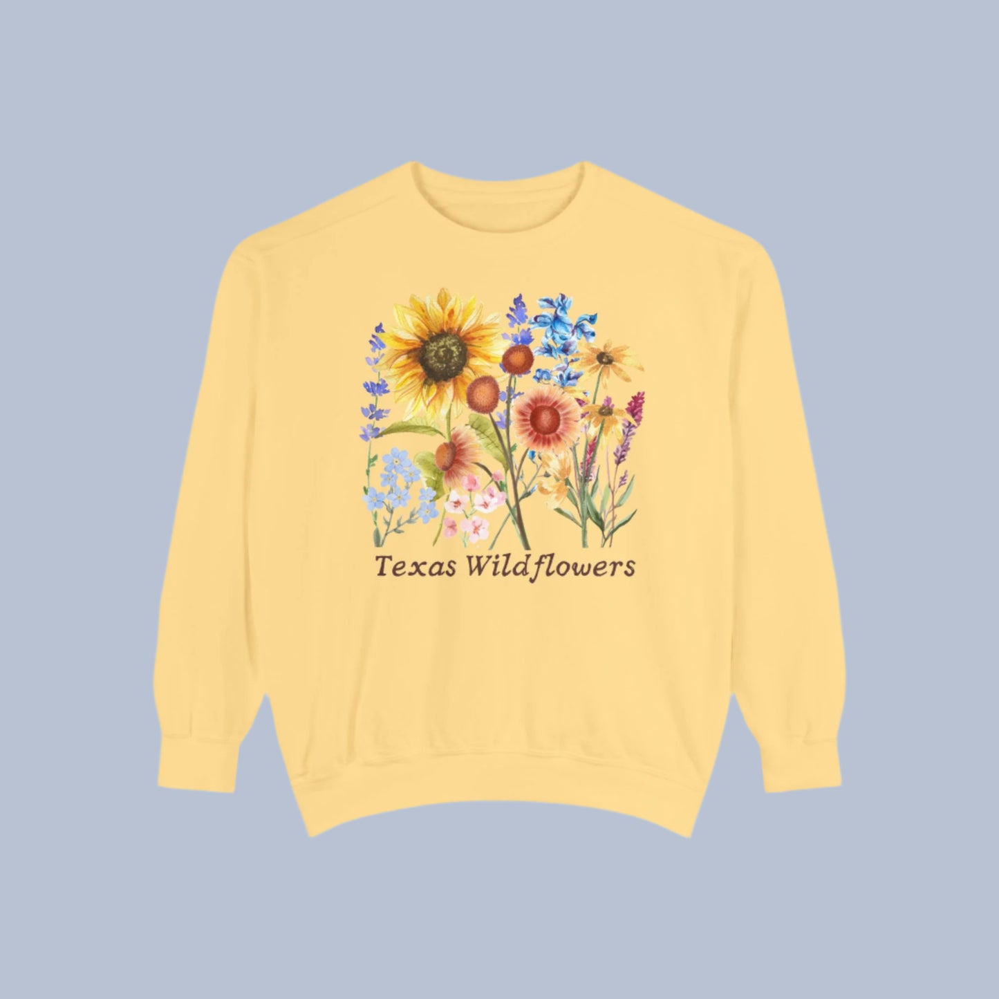 Comfortable floral Texas sweatshirt printed with native blooms like bluebonnets and Indian paintbrush on a classic crewneck. This soft fleece top offers relaxed, cozy style inspired by Texas wildflower season. Designed for nature-loving mamas, flower enthusiasts, and fans of cottagecore and boho aesthetics. A great gift for spring birthdays, road trip partners, or garden lovers.