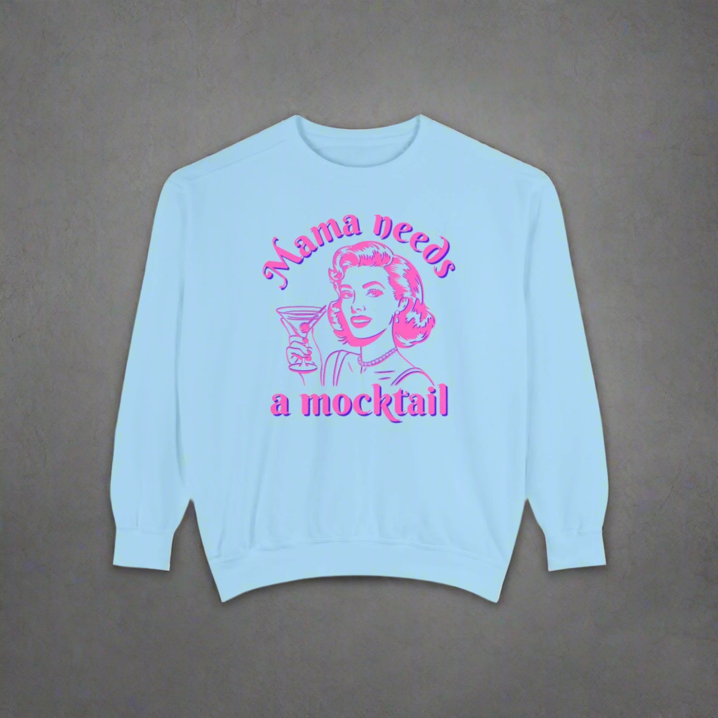 Image: Mama Needs a Mocktail pullover sweatshirt in Chambray (light blue). This sweater is a perfect gift for someone who is sober curious or California sober. Its a cute girly Bartender Gift or a Funny Sober Shirt Gift For New Mom Tee, by jaecrece
