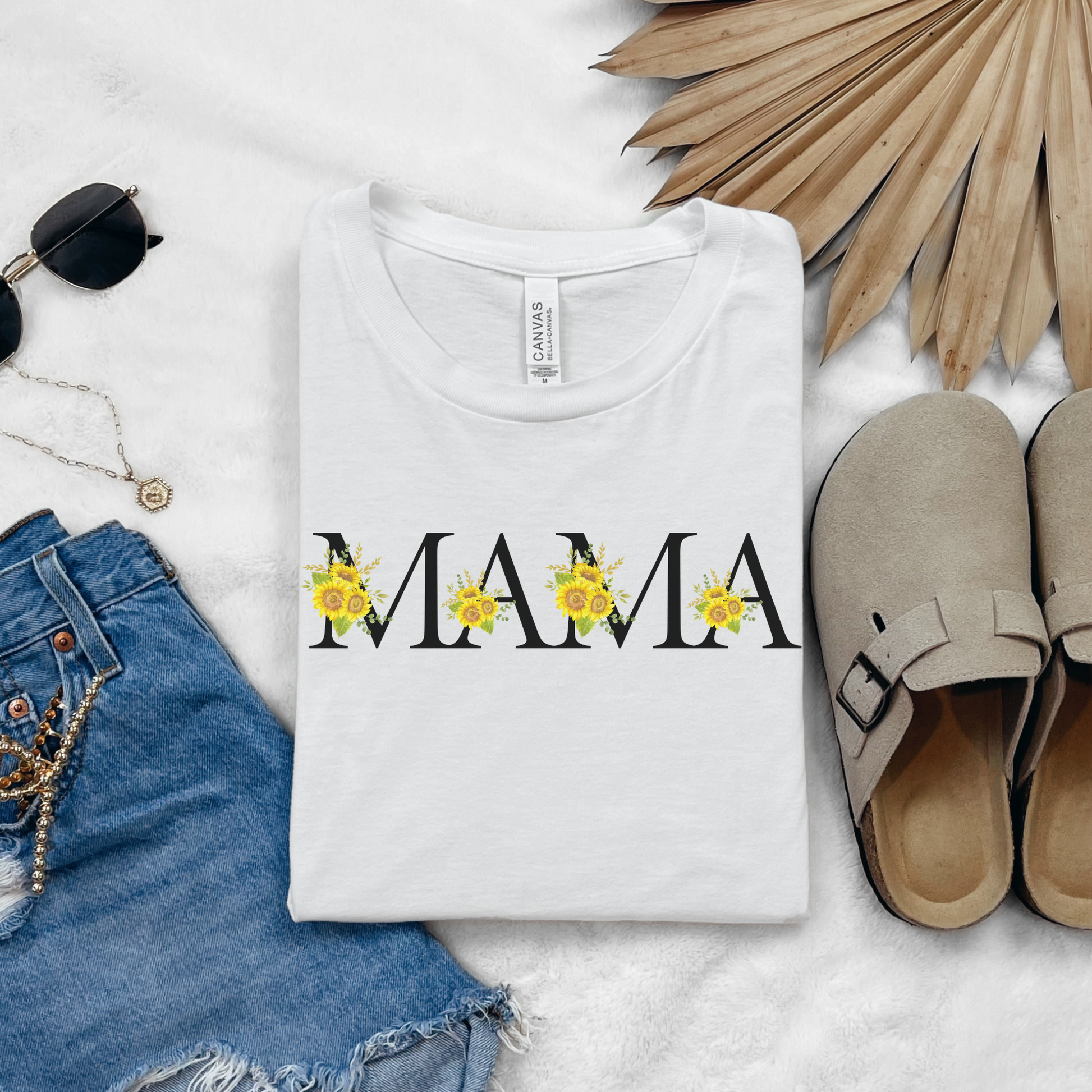 Image: MAMA sunflower tshirt, available in white, light pink and ash. This pullover crewneck features the word MAMA in large black block letters with sunflower calligraph accent. A great baby announcement gift or Mothers day present by jaecrece