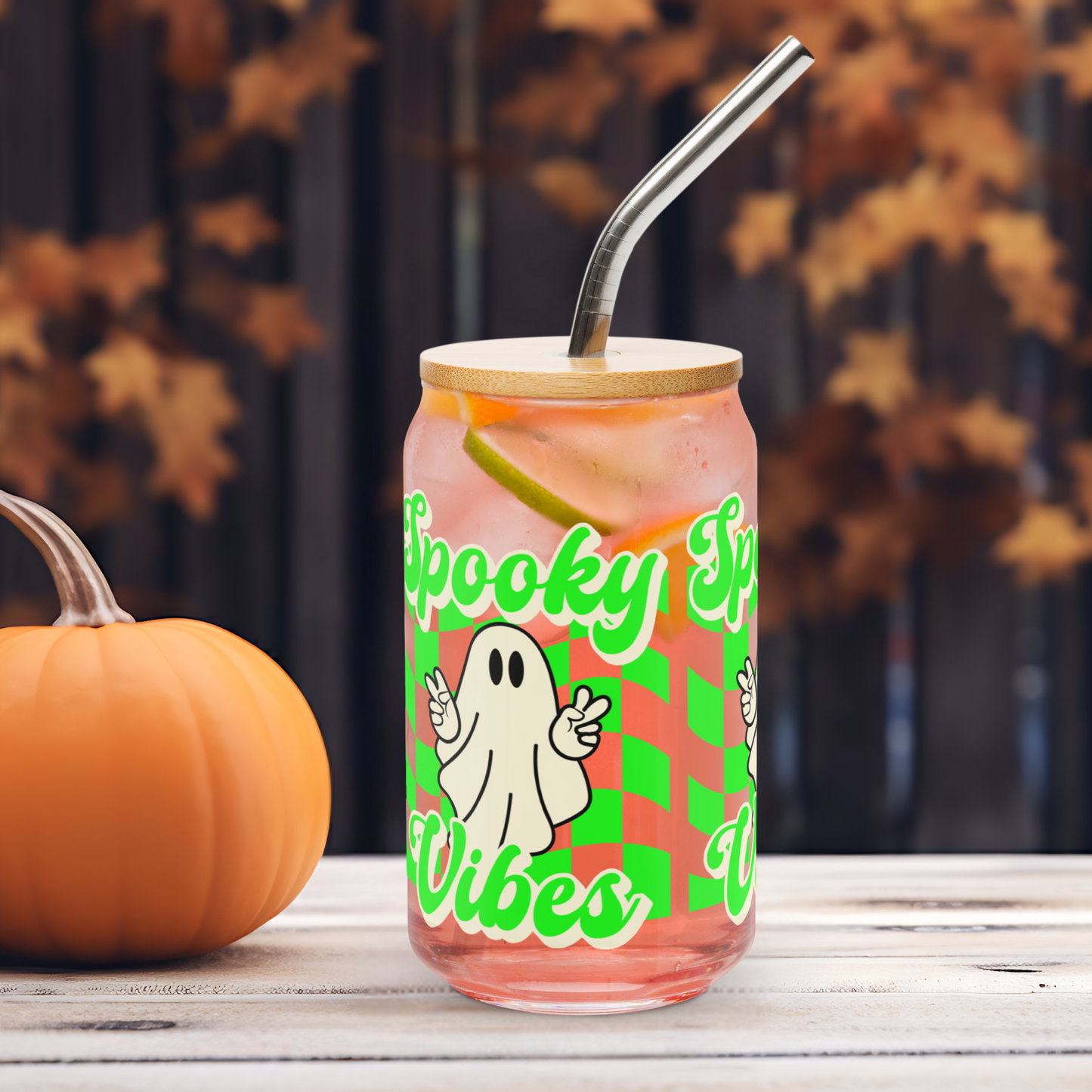Surrounded by pumpkins and cozy fall décor, this Spooky Vibes sipper glass is a festive addition to your Halloween kitchen setup. The cute ghost, bamboo lid, and vivid neon checkerboard pattern make it a standout in seasonal drinkware. Great for social media-worthy setups, gift baskets, or your autumn beverage routine, it’s a must-have for Halloween lovers and iced coffee girlies.