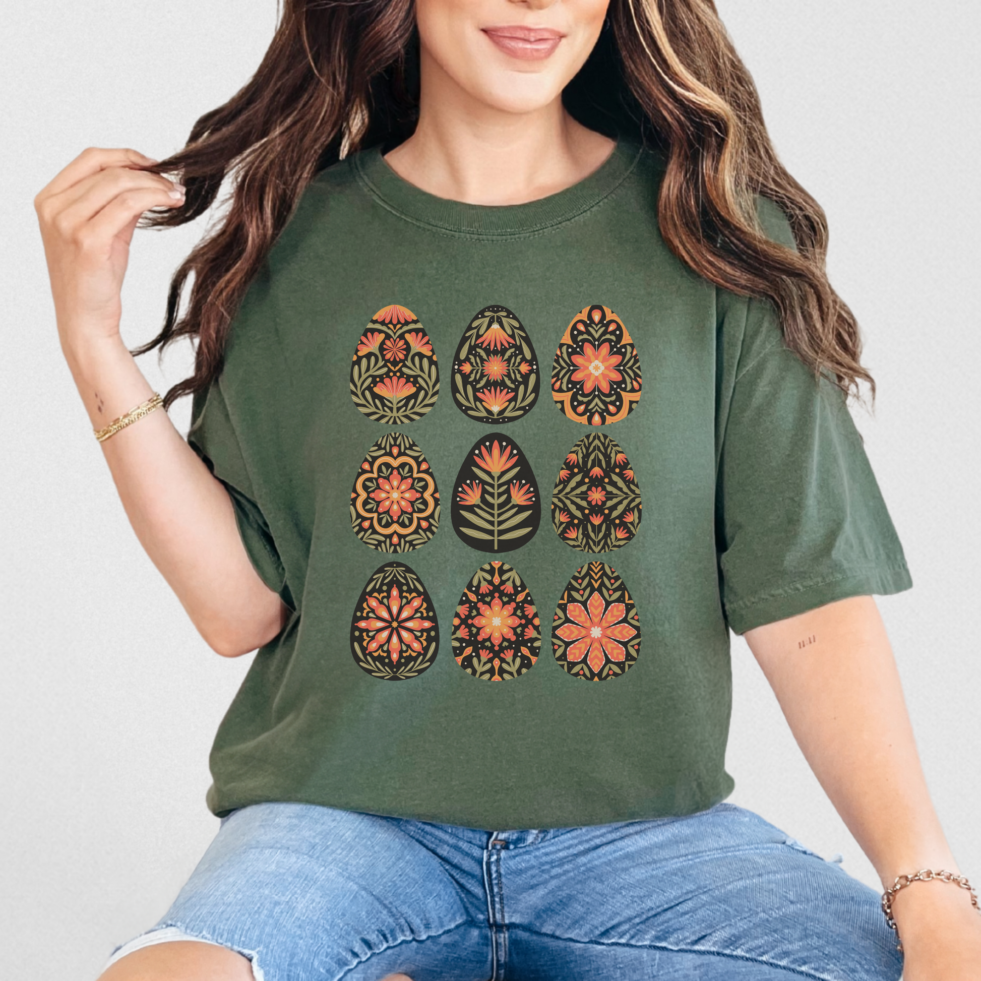 Image: This folk art Easter shirt features a vibrant floral and botanical Easter egg design with vintage Scandinavian influences. The intricate patterns reflect traditional Nordic craftsmanship, creating a timeless spring fashion statement. Perfect for casual outings or Easter festivities, this soft and stylish t-shirt brings together the beauty of cottagecore, boho aesthetics, and Swedish hygge in one charming piece, by jaecrece.