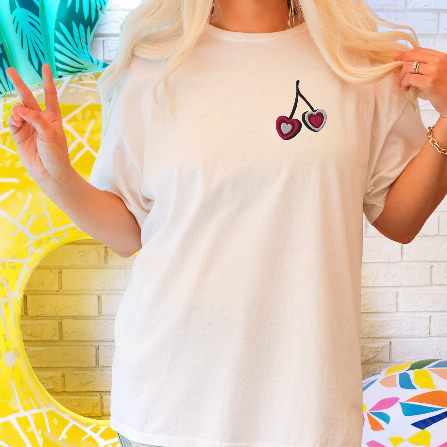 Image: A cozy and trendy embroidered cherry sweatshirt designed for those who love the coquette aesthetic. The delicate fruit embroidery adds a cute yet sophisticated touch, making it an ideal Valentine’s Day gift or a stylish wardrobe essential. The soft fabric and timeless design make it a perfect layering piece for spring and summer, effortlessly pairing with skirts, jeans, or casual outfits, by jaecrece.
