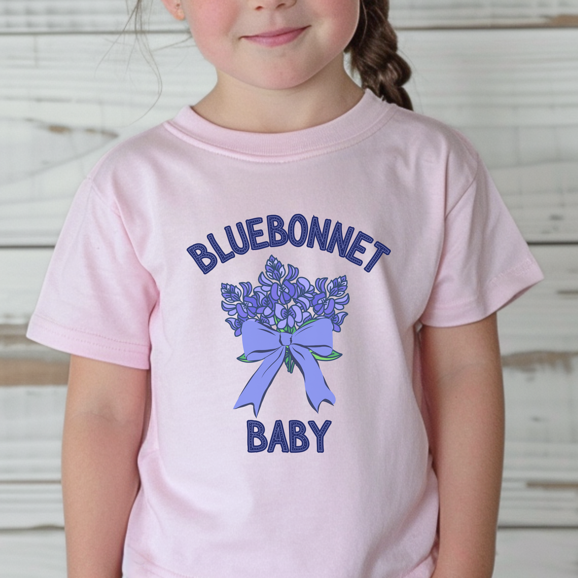 Image: This cute toddler t-shirt features a stunning bluebonnet design, making it a great outfit for spring adventures. The breathable cotton fabric ensures comfort for all-day wear at family gatherings, nature walks, or Easter celebrations. Designed with Texas pride in mind, it’s a must-have for parents who love their state’s wildflowers. A perfect baby shower gift or birthday present for Texas-born little ones, this tee is a springtime favorite, by jaecrece.