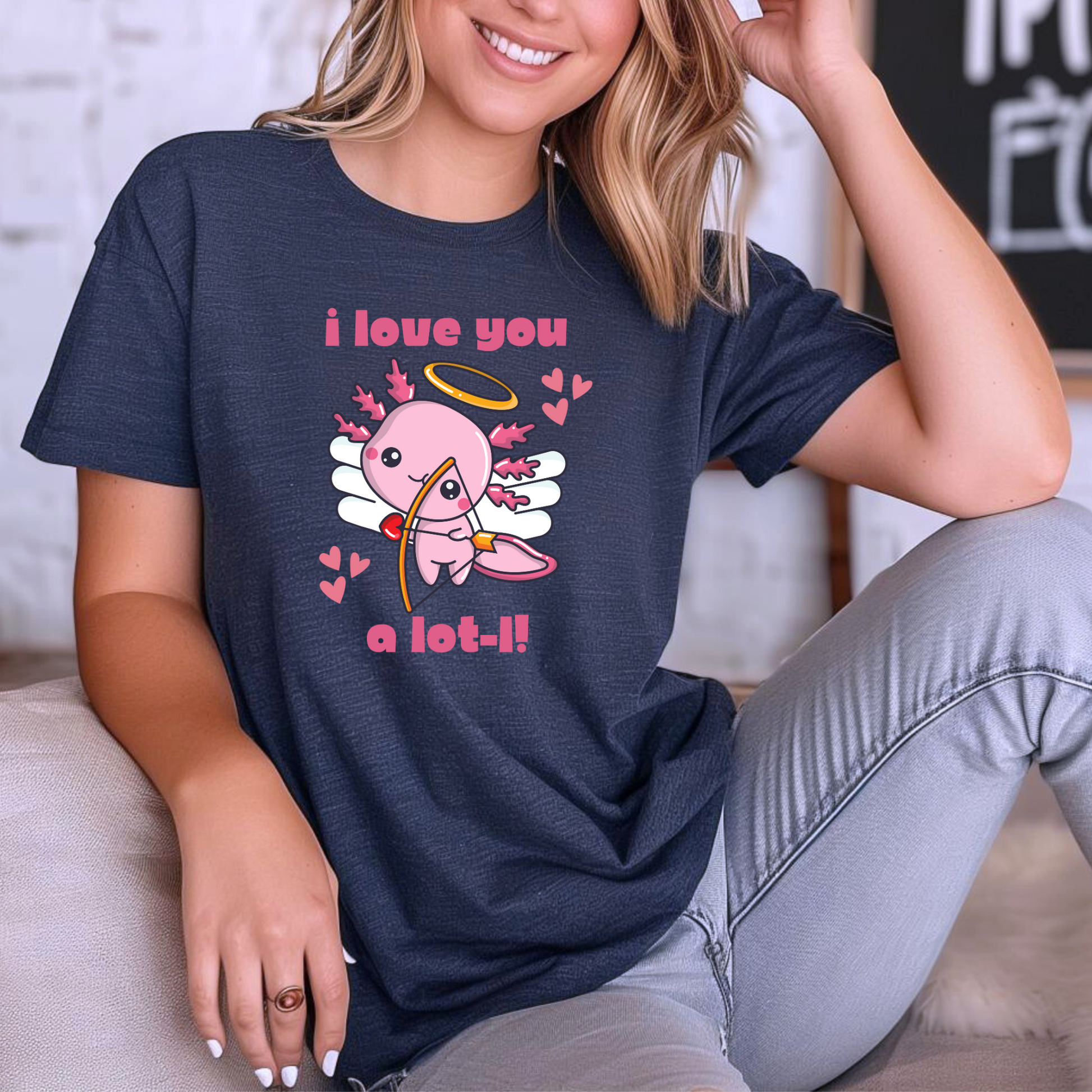 Celebrate love with this “I Love You A Lot-L” axolotl Valentine’s shirt for women. Featuring a pink axolotl cupid with playful hearts, this Bella Canvas 3001 tee combines comfort and style in sizes XS–XL. Ideal for quirky Valentine’s Day outfits, teachers, animal lovers, and women who love cute graphic tees. Perfect for date night, classroom celebrations, or as a fun Valentine’s gift for girlfriends, wives, and axolotl enthusiasts.