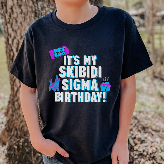 This Skibidi Sigma birthday shirt for kids features the phrase “Hey Bro! It’s my Skibidi Sigma Birthday!” in bold lettering, making it the ultimate funny T-shirt for tweens, boys, and girls. Available in Navy, White, Black, and Sport Grey, this meme-inspired birthday tee is ideal for gamer kids, Skibidi Toilet fans, and trend-loving teens who want to celebrate in viral style with rizz and a bit of birthday bruh energy.