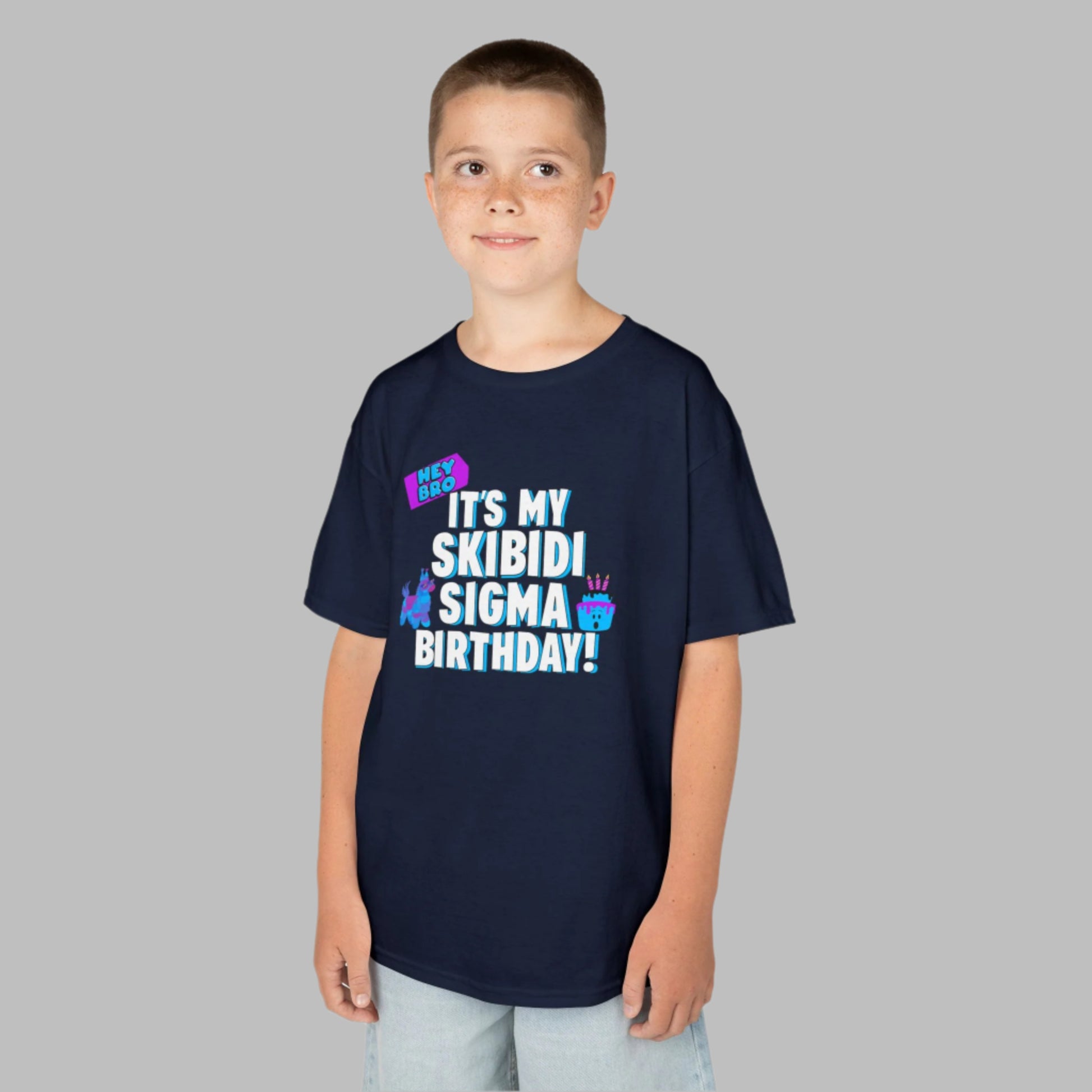 Give your gamer or meme-loving child the birthday outfit of their dreams with this Skibidi Sigma T-shirt for kids. Featuring the text “Hey Bro! It’s my Skibidi Sigma Birthday!” this shirt celebrates viral trends and birthday fun in one. Available in Navy, White, Black, and Sport Grey, it’s perfect for tweens, teens, and anyone who lives for Skibidi Toilet memes and Sigma bro energy.
