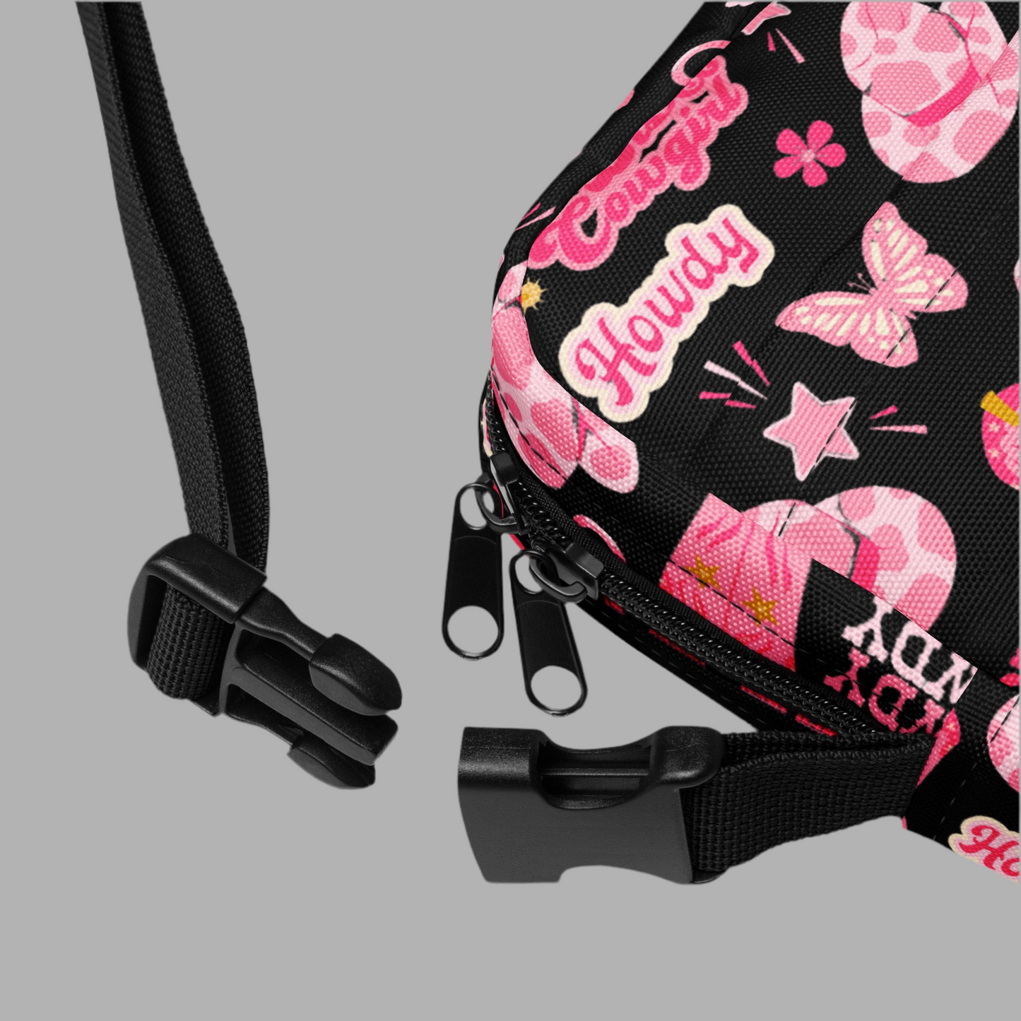 Image: Disco Cowgirl Canvas Crossbody Bag. This small black sling bag features a western glam hot pink pattern of cowgirl boots, cowgirl hats, butterflies and horseshoes. The pattern reads Disco Cowgirl, Yee-Haw and Howdy. The perfect mini backpack for bachelorette parties, gifts for teens or tweens, or trips to the state fair, by jaecrece