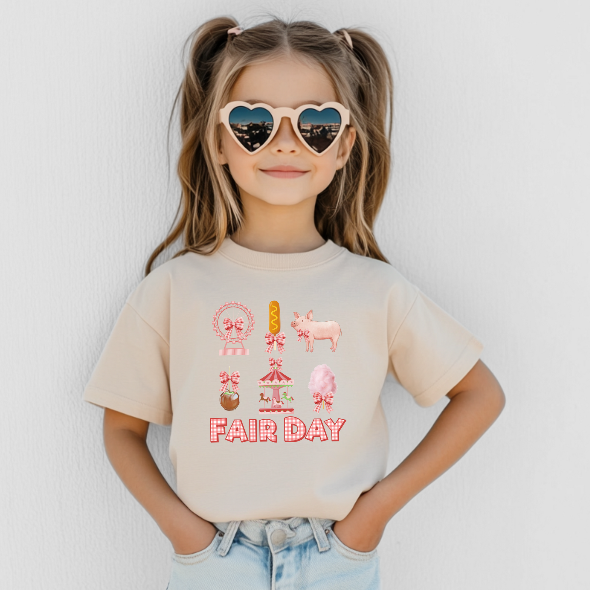 Image: Cute and festive Fair Day t shirt featuring playful gingham lettering and adorable fair inspired graphics such as a pig, Ferris wheel, cotton candy, and caramel apple. With its coquette style, this tee is perfect for mothers and daughters looking for matching outfits at fairs and festivals. Whether enjoying corndogs or livestock exhibits at the Texas, Minnesota, or Iowa State Fair, this shirt adds a stylish country charm to the day, by jaecrece.