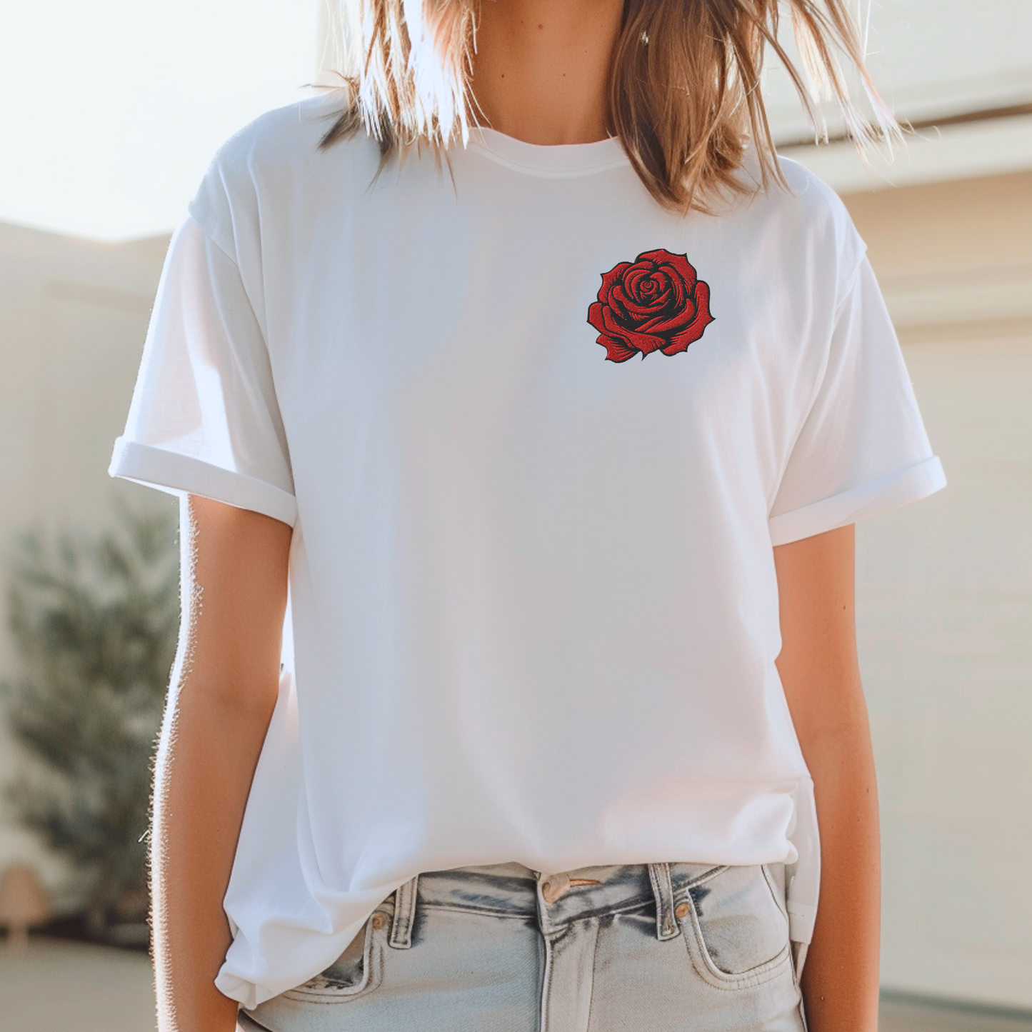Image: This soft and cozy embroidered pullover features a delicate yet bold red rose, evoking the beauty of traditional tattoo artistry. Designed for comfort and style, it is perfect for casual wear or layering on cooler days. Ideal as a thoughtful gift, this sweatshirt makes a statement while maintaining a timeless, floral elegance. Celebrate the beauty of roses and artistic expression with this stunning embroidered design, by jaecrece.