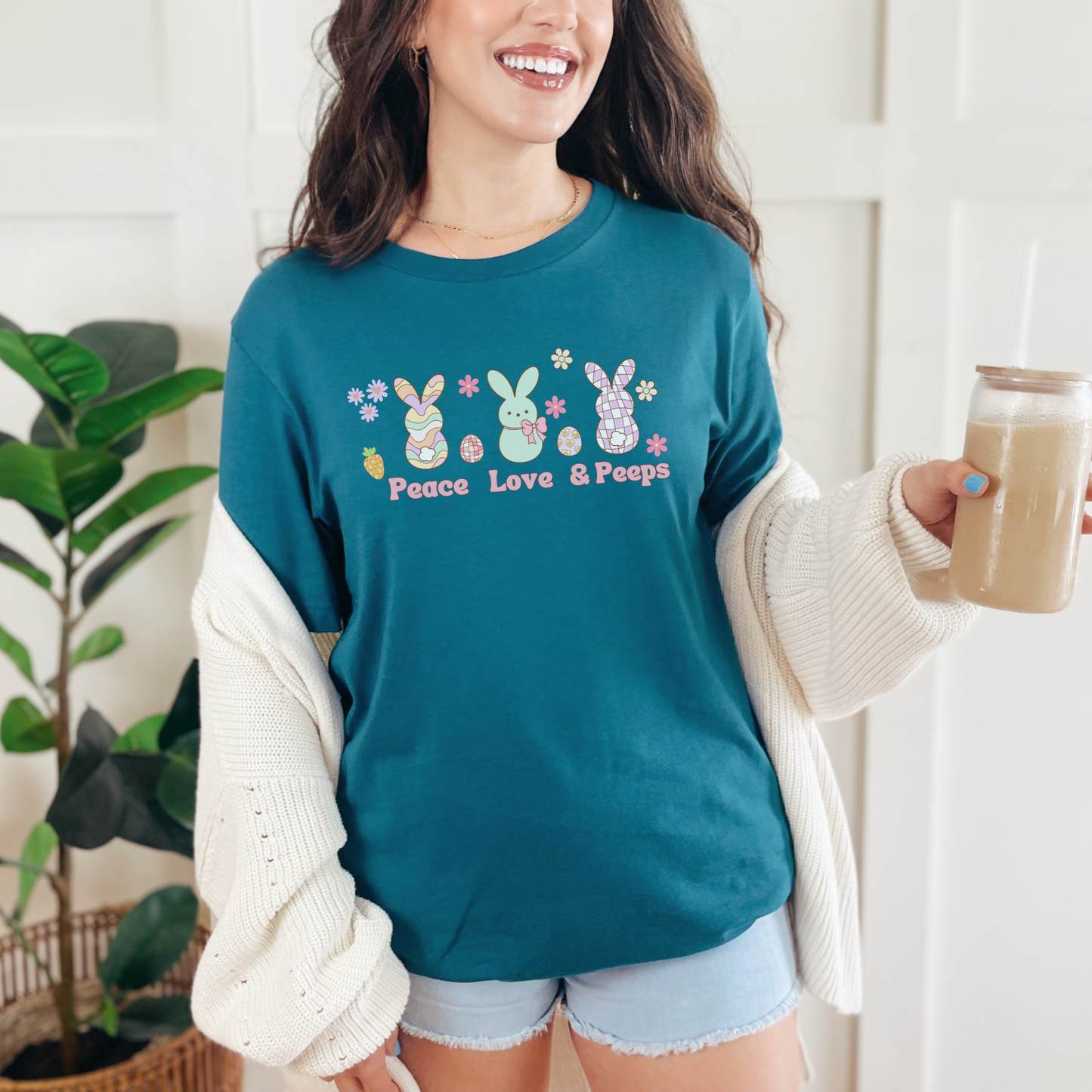 Image: Peace Love and Peeps Easter Shirt for Adults and Children. This Mommy and Me Match Easter Tee features Peeps Easter Candy with Easter Eggs and Daisies. A great Easter shirt for your family holiday celebrations, by jaecrece