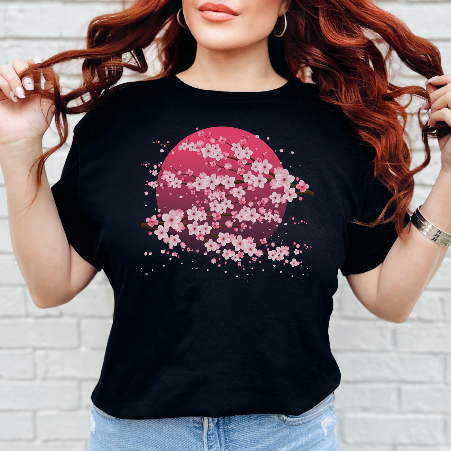 Image: A pink cherry blossom t-shirt featuring a delicate sakura tree design. The soft, durable fabric offers comfort, while the classic fit makes it versatile for any occasion. Perfect for springtime celebrations, Japanese aesthetic lovers, and those who appreciate kawaii fashion. Ideal as a gift for teens and adults.