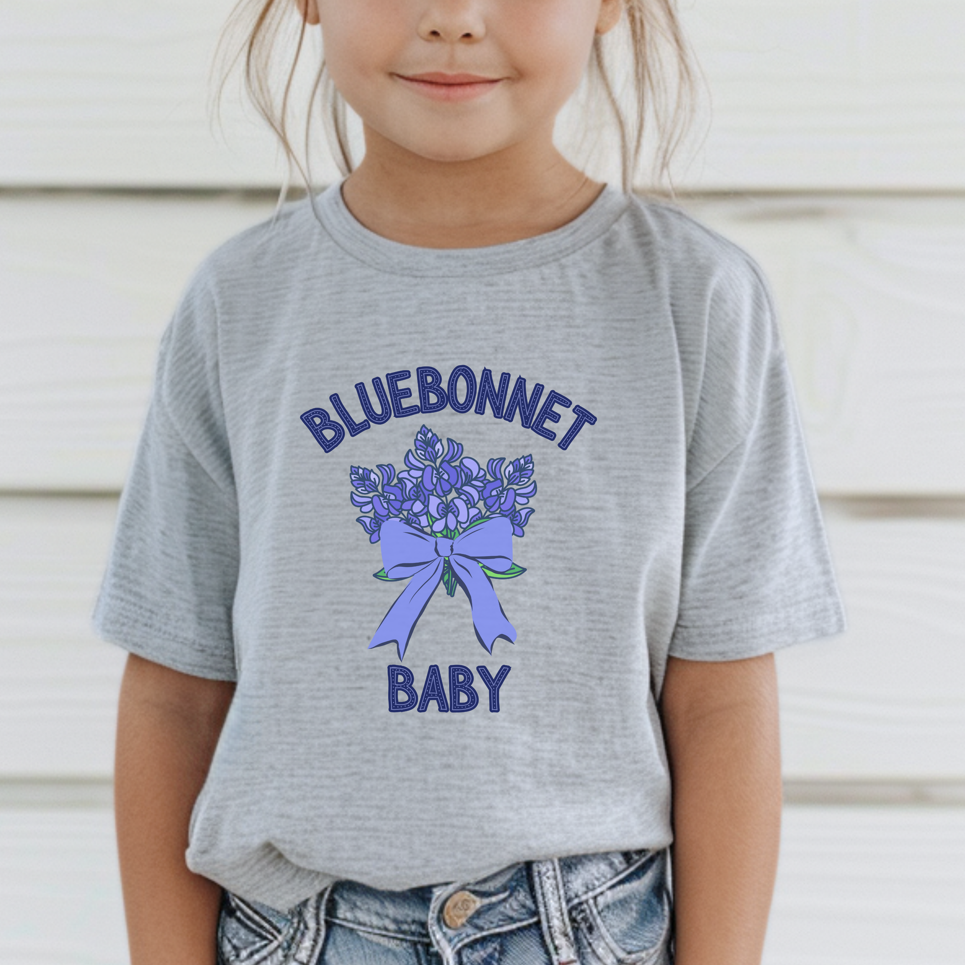 Image: This cute toddler t-shirt features a stunning bluebonnet design, making it a great outfit for spring adventures. The breathable cotton fabric ensures comfort for all-day wear at family gatherings, nature walks, or Easter celebrations. Designed with Texas pride in mind, it’s a must-have for parents who love their state’s wildflowers. A perfect baby shower gift or birthday present for Texas-born little ones, this tee is a springtime favorite, by jaecrece.