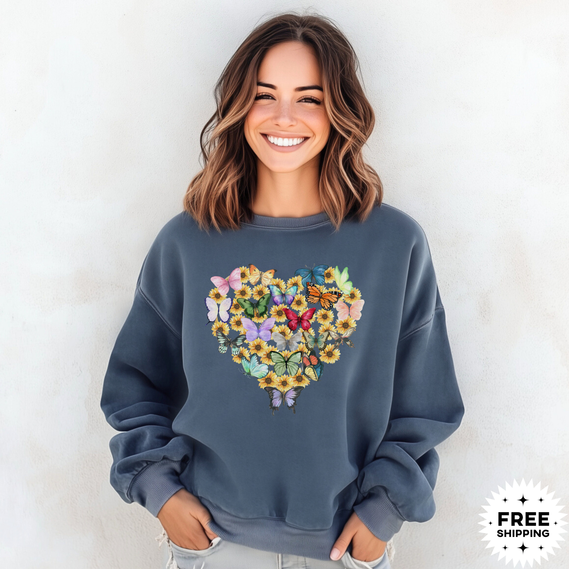 Image: Butterfly Sunflower Heart Womens Sweatshirt. This nature inspired cozy pullover sweatshirt has  watercolor wildflowers and butterflies. Comfort colors available in violet, Blue spruce and denim. Great for Earth Day, Valentines Day, by jaecrece