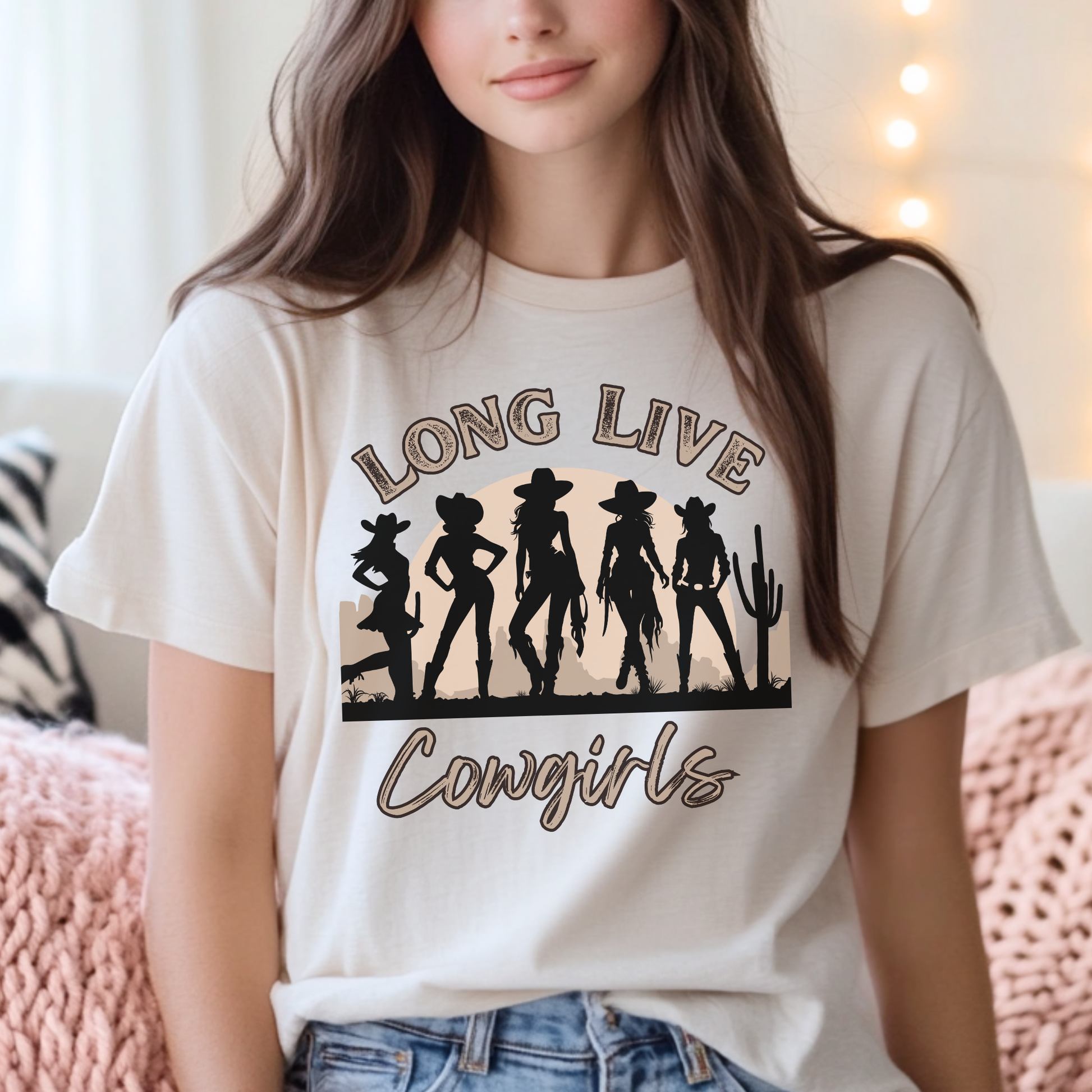 Image: A soft, oversized country tee with Long Live Cowgirls printed above five bold cowgirl figures, bringing vintage western style to life. The relaxed fit and earthy tones make it the perfect choice for music festivals, rodeos, and everyday country wear. Whether you are a true western spirit or just love rustic fashion, this shirt blends comfort and charm effortlessly, by jaecrece.