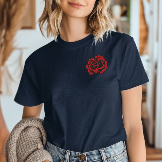 Image: This embroidered rose shirt features a striking red rose stitched in exquisite detail, inspired by classic tattoo designs. The pullover’s soft fabric makes it perfect for cozy days, while the bold floral motif adds a timeless, artistic touch. Ideal as a gift for her or a stylish staple for anyone who appreciates vintage inked aesthetics. Celebrate your love for flowers, tradition, and artistry with this charming sweatshirt, by jaecrece.